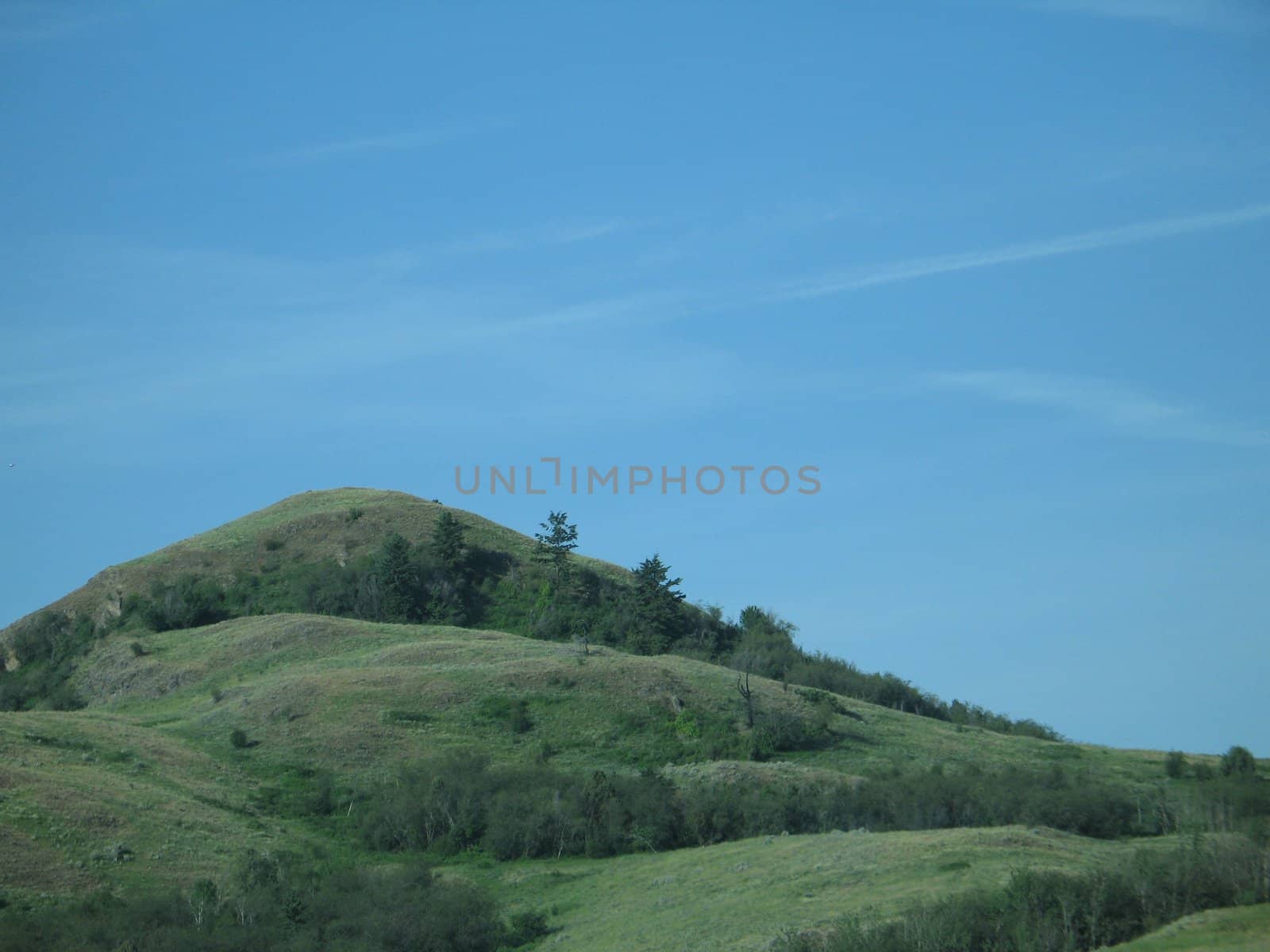 green hill and blue sky