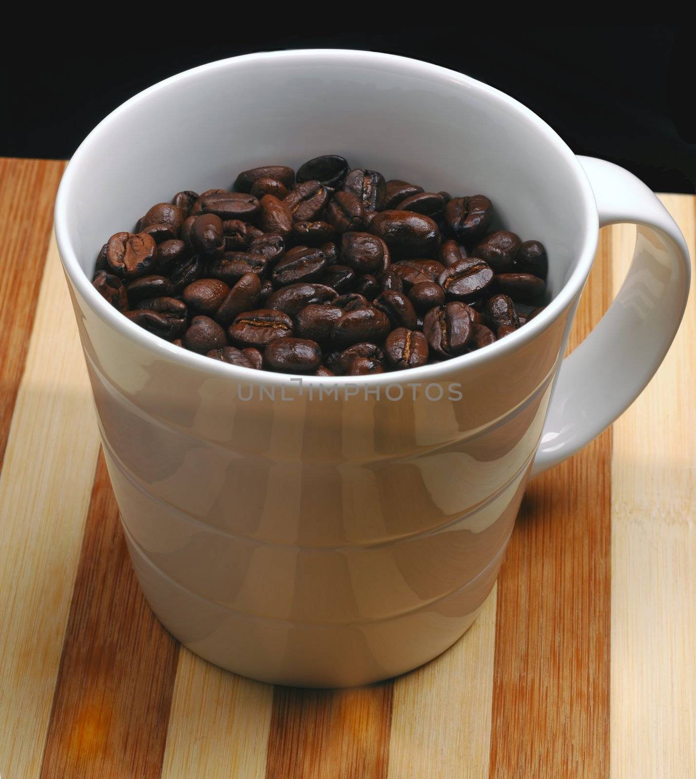 coffee beans on a cup  on a wood board