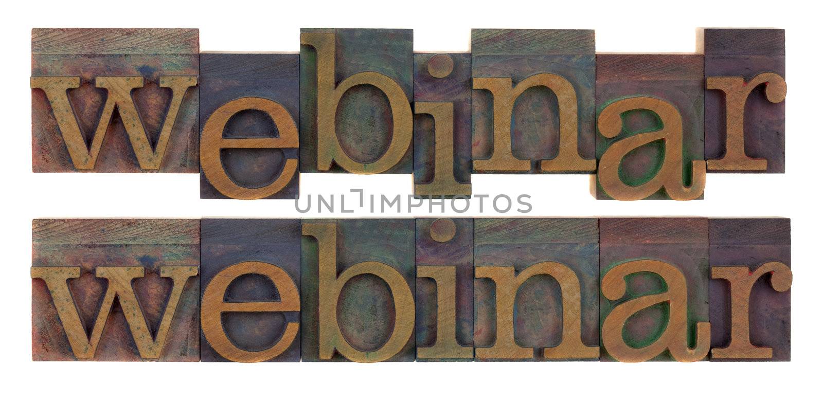 the word webinar in vintage letterpress wood type, stained by color inks, isolated on white