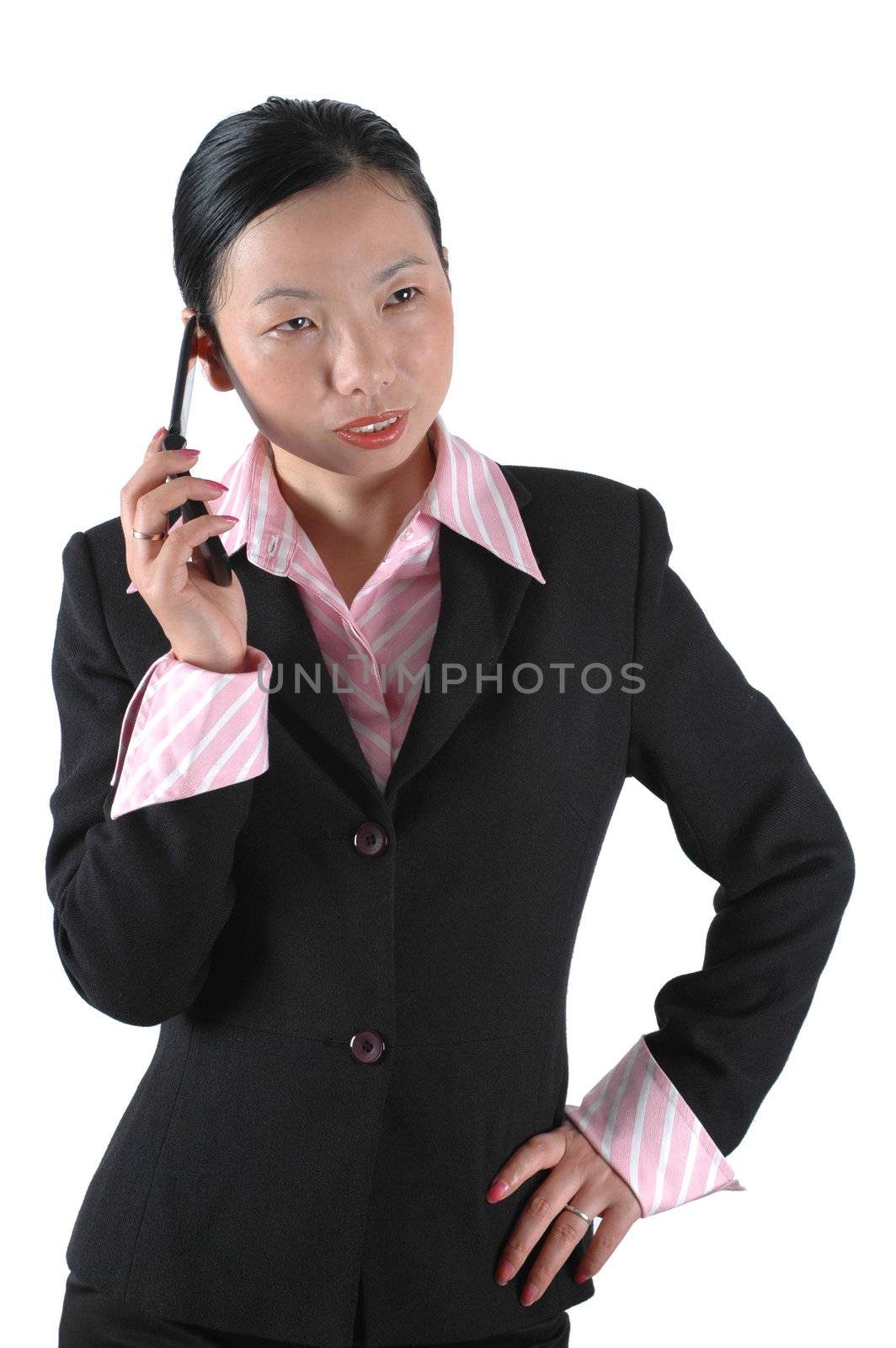 Chinese businesswoman, wearing lady's suit and shirt. Using mobile phone.