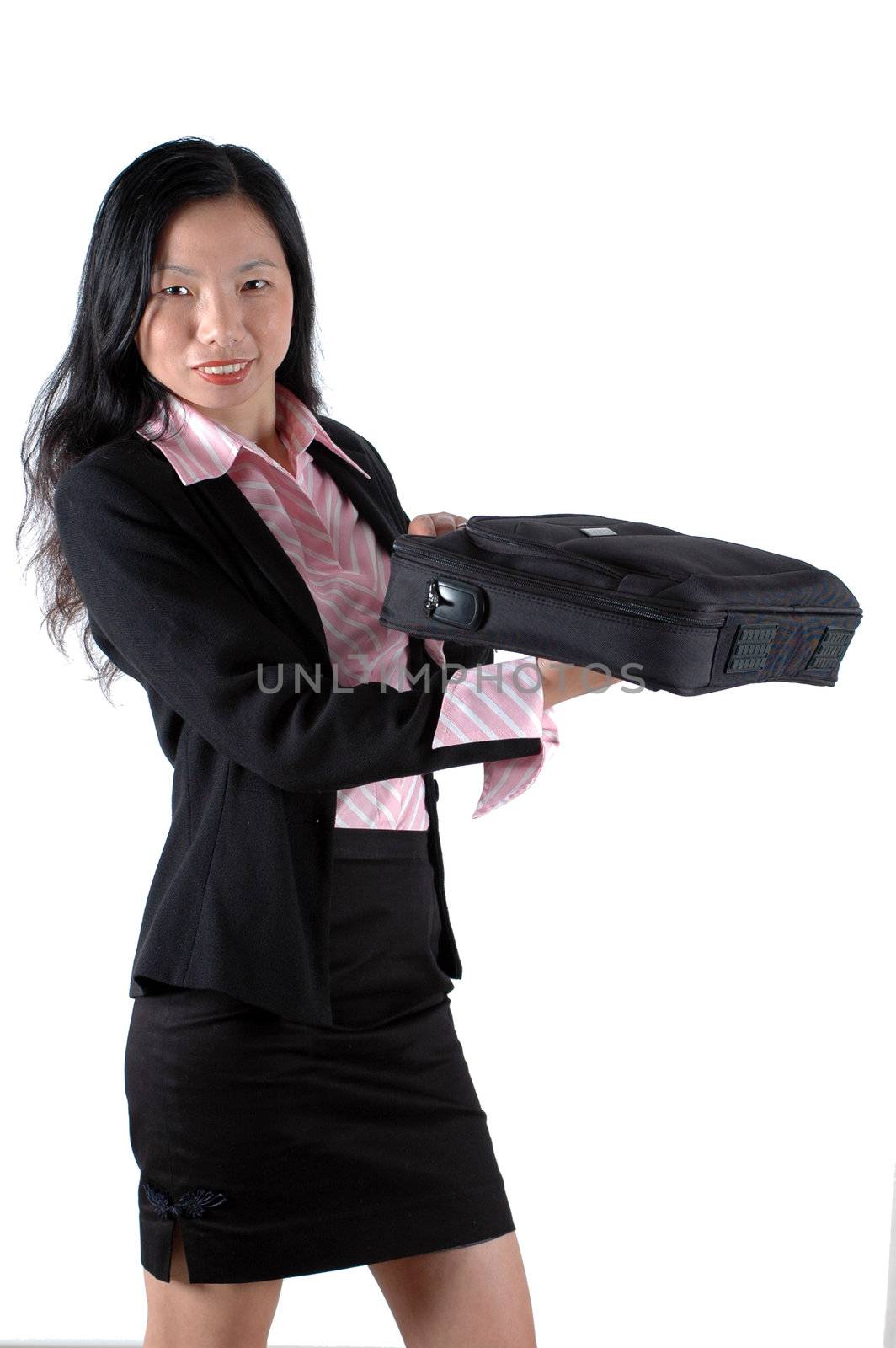 Chinese businesswoman, smiling and holding briefcase, laptop bag, wearing lady's suit and shirt. 