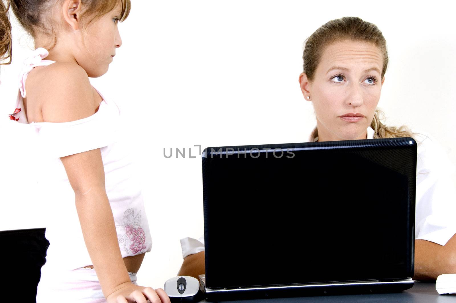 portrait of mother and daughter with laptop