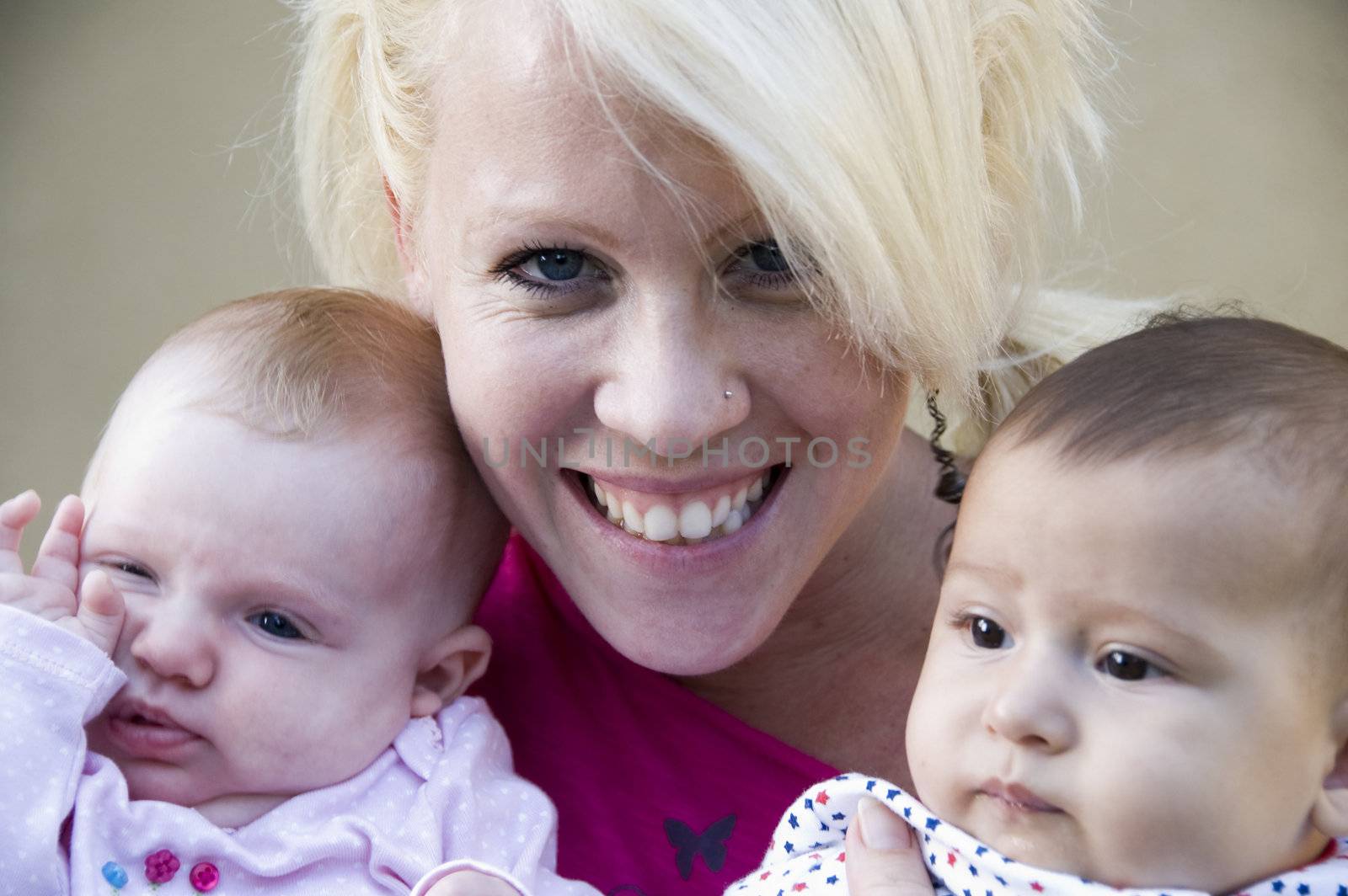 beautiful mother posing with her two kids by imagerymajestic