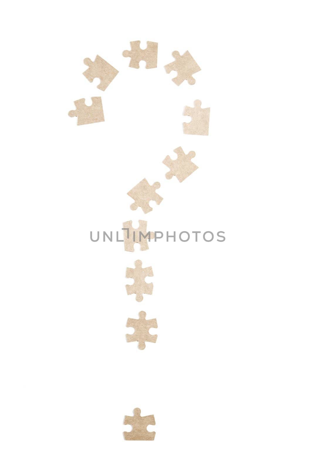 question mark made of puzzle pieces on white background