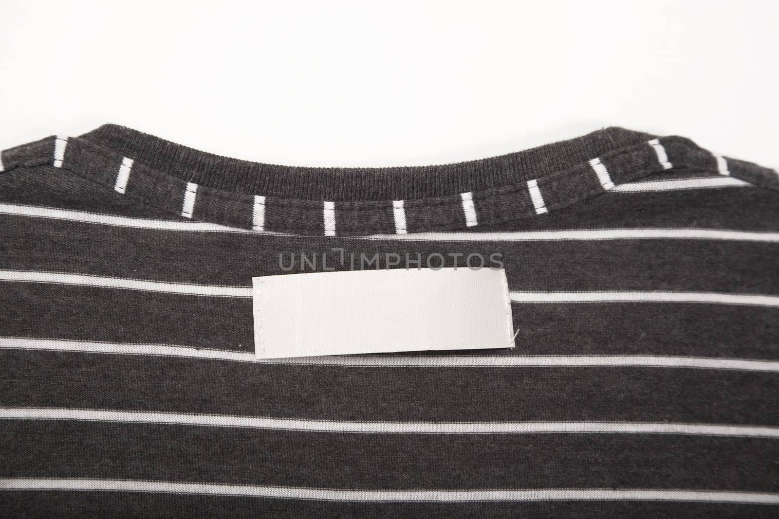 blank t-shirt label on striped texture cloth