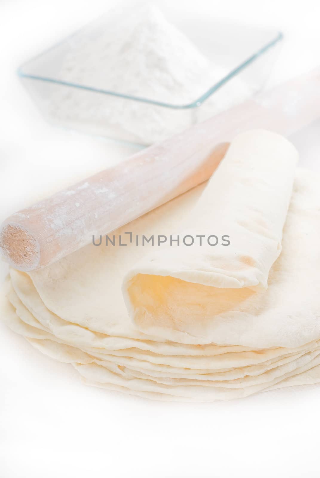 making fresh homemade pita bread ,with ingredients overa table