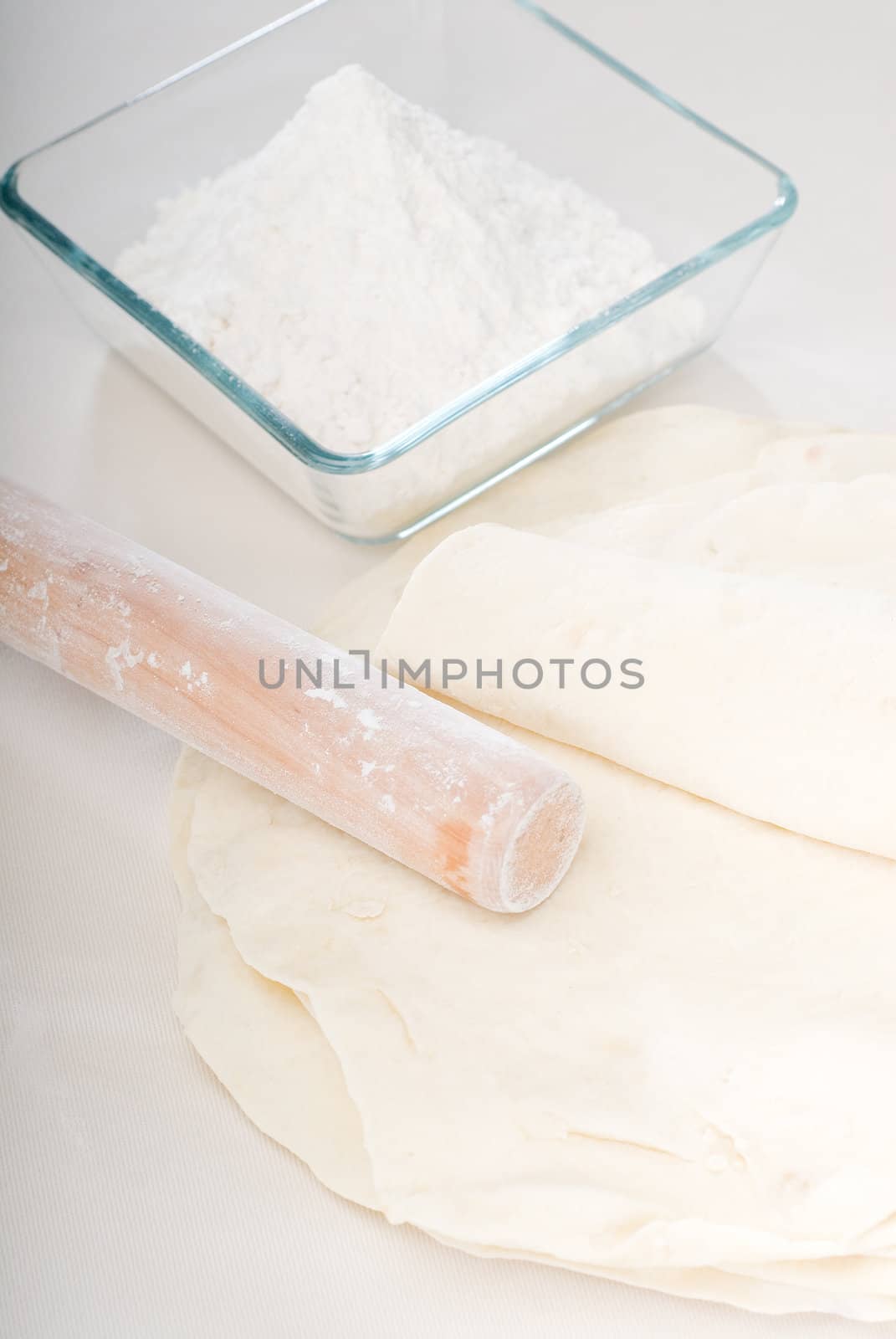 making fresh homemade pita bread ,with ingredients overa table