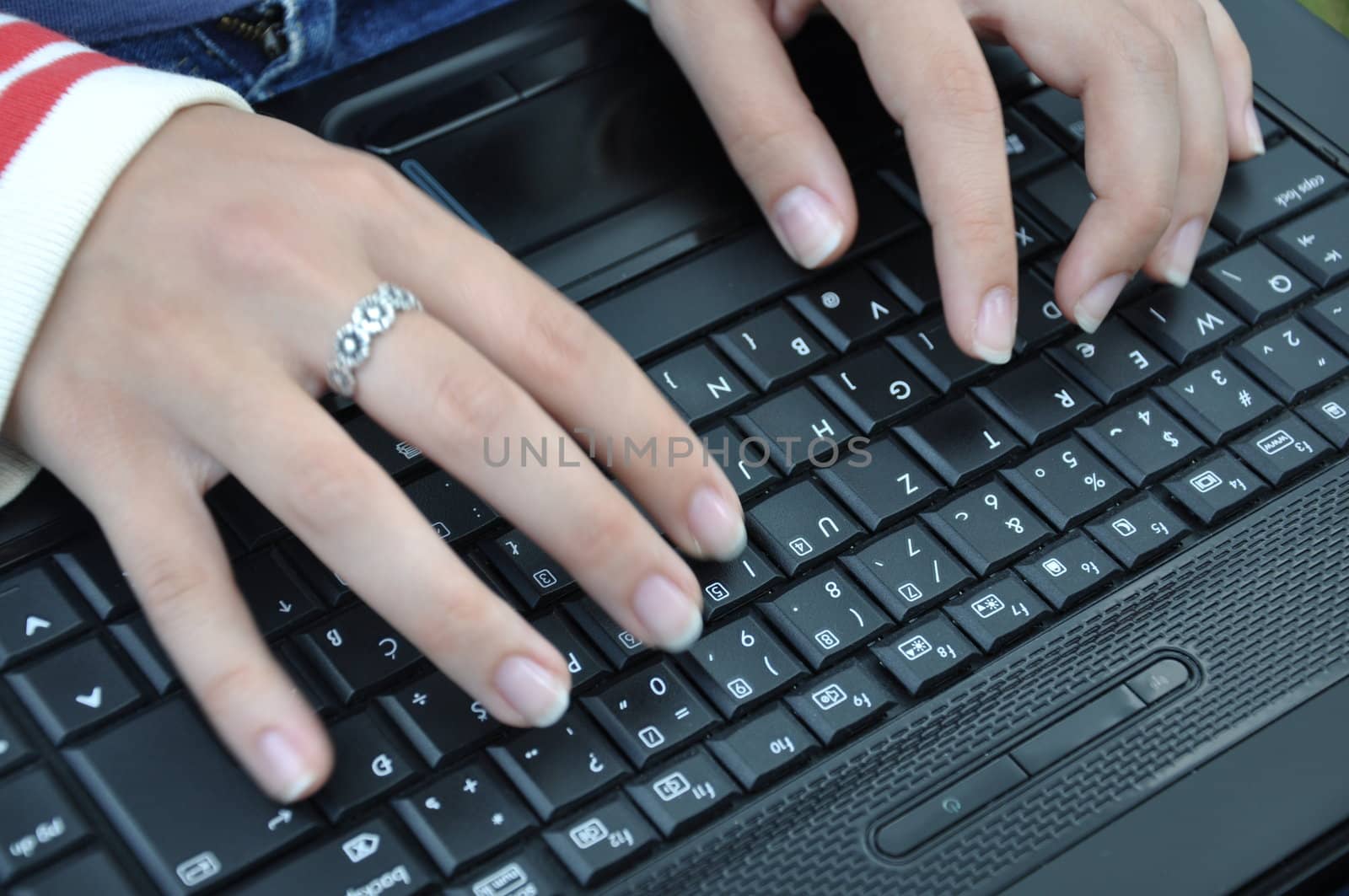 girl typing on keyboard