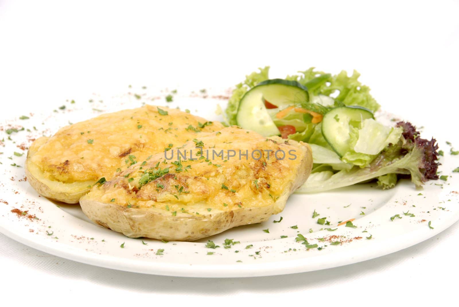 Baked Potato topped with cheese and served with a cold salad.