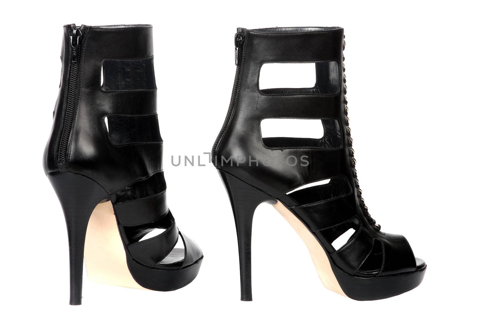 Black female shoes on a high heel. It is isolated on a white background