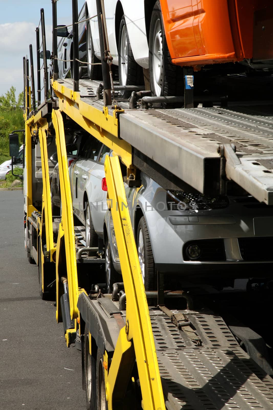 Semitrailer transporting new cars. Export-import of goods.