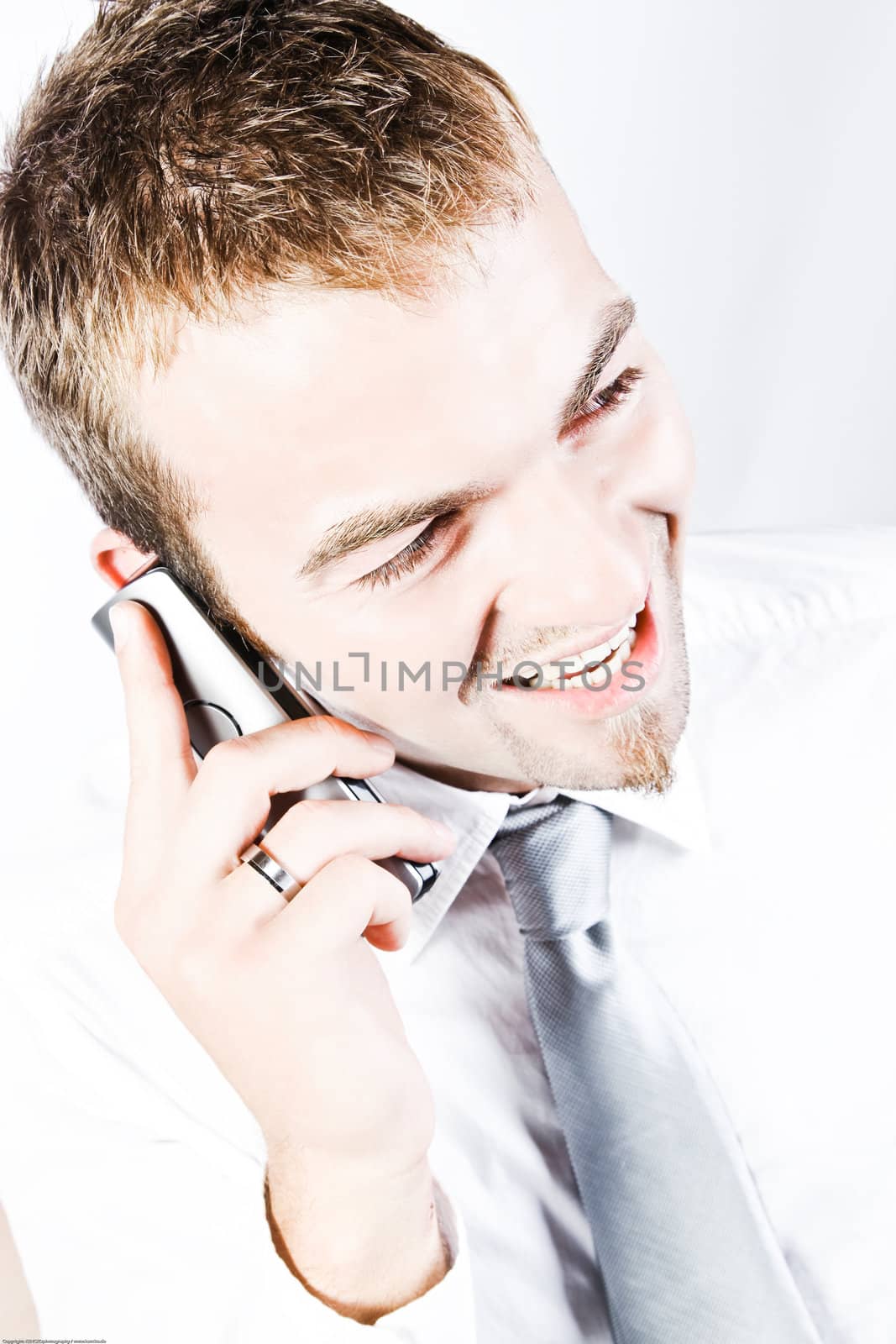 Young Corporate Man Having A  Promising Business  Phone Conversation