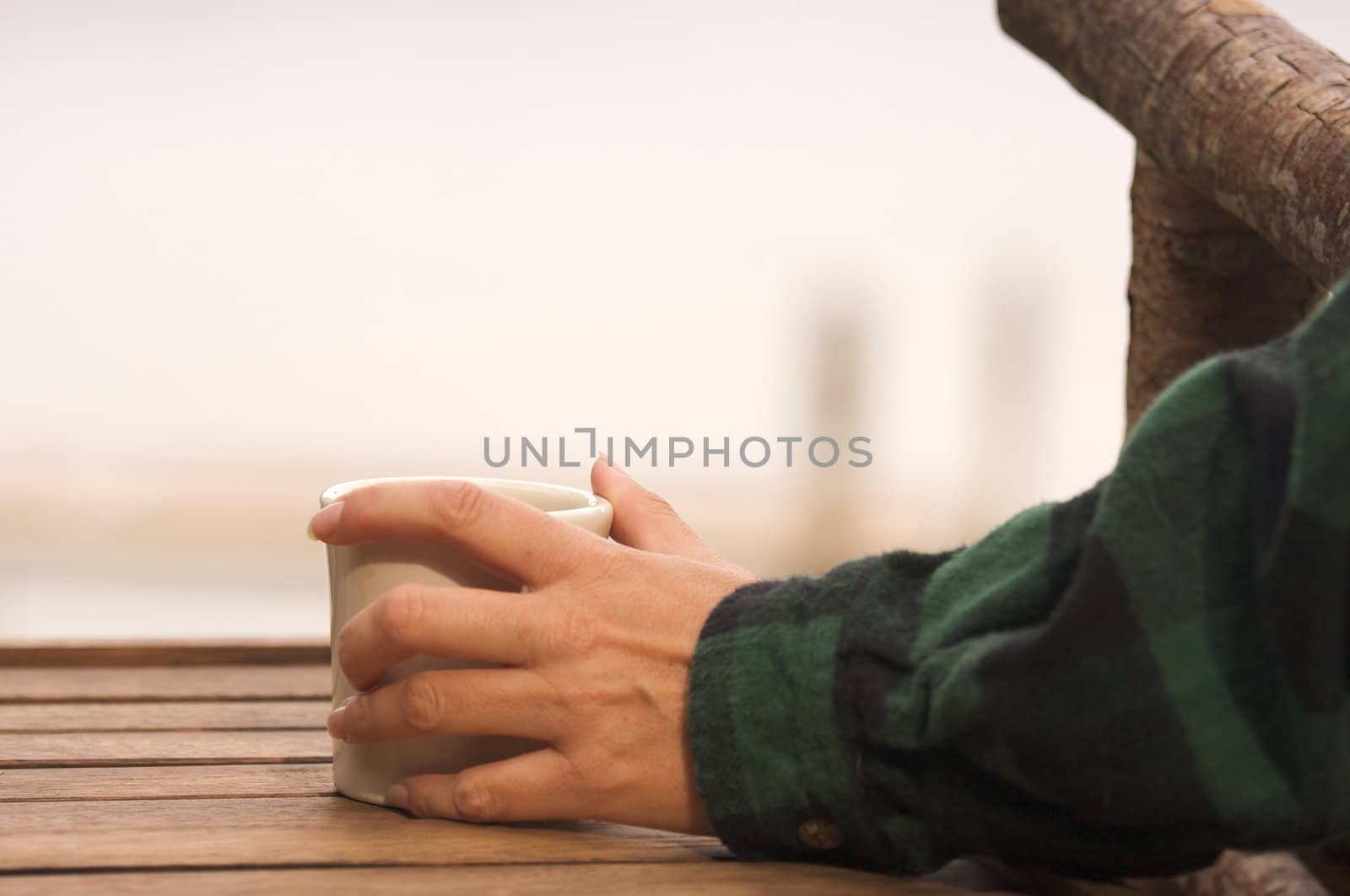Woman Enjoys Morning Cup Coffee on the Lake.