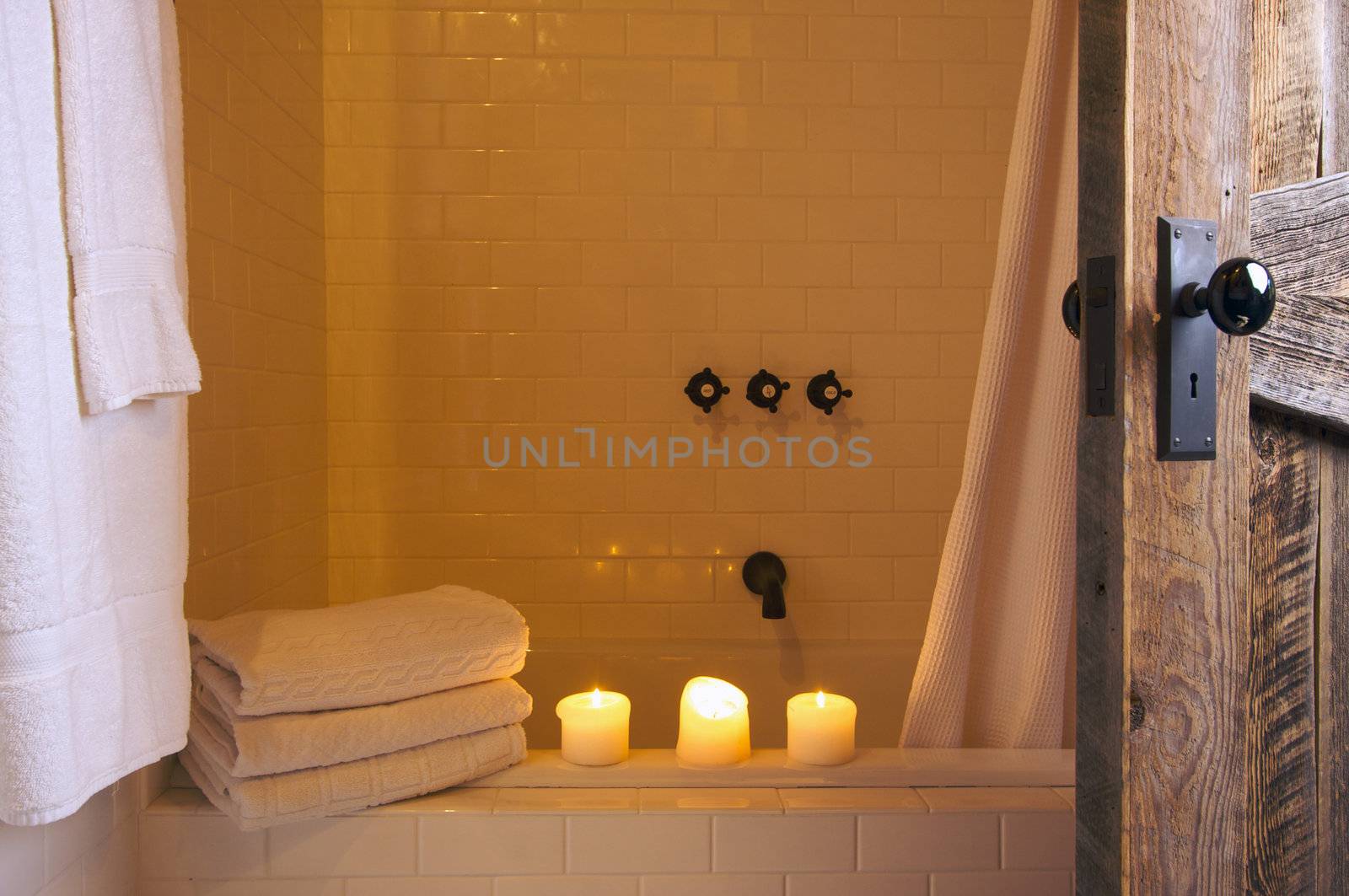 Rustic Bathroom Scene with Towels and Candles