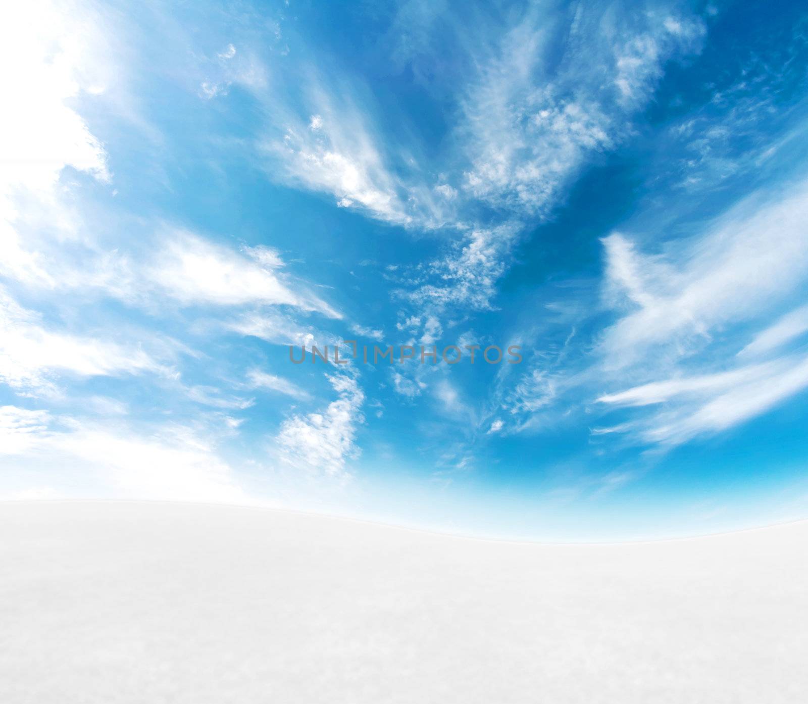 A simple tranquil beautiful S-curved horizon with blue sky and snowy hills.