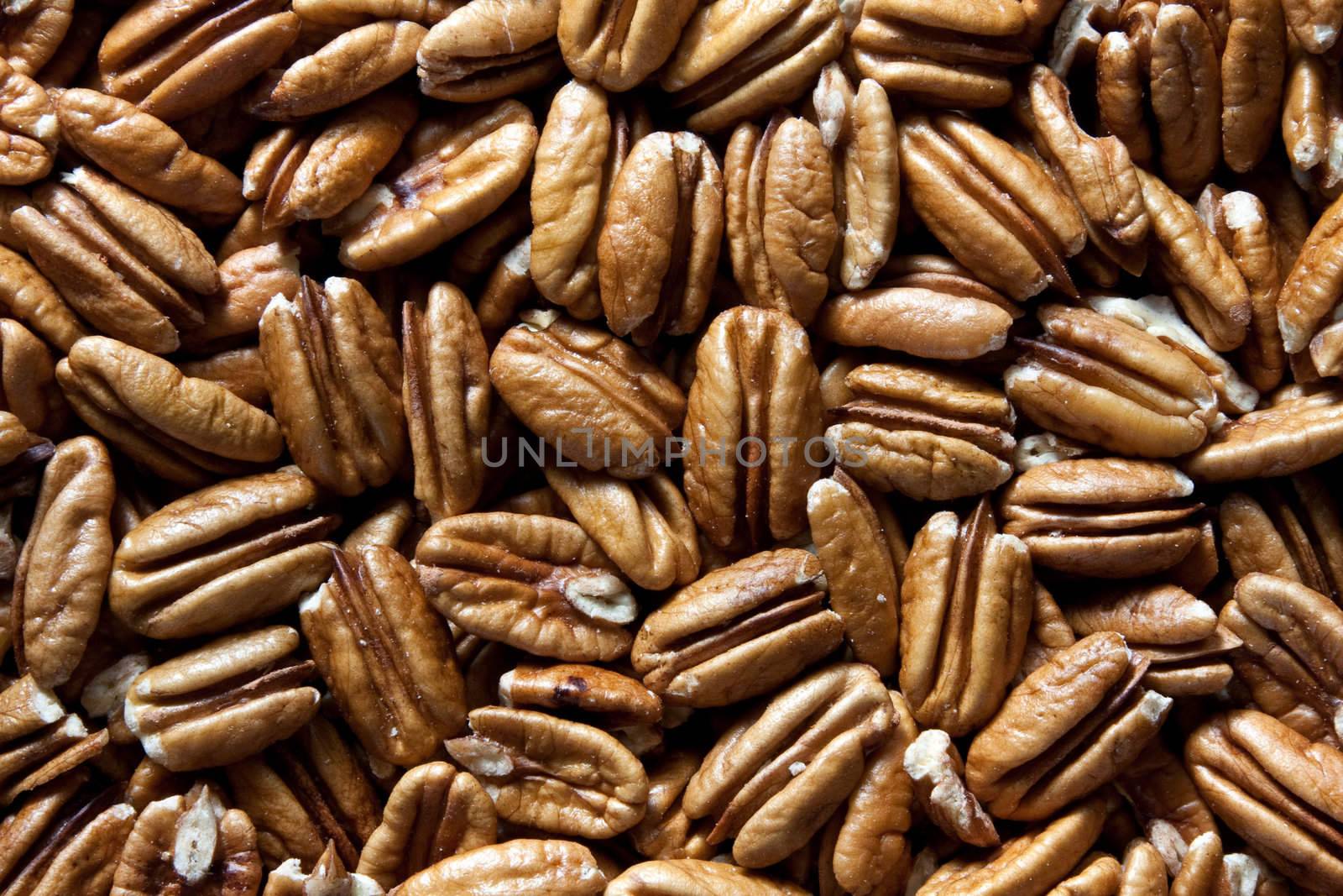 Raw, dried, and shelled pecan nuts