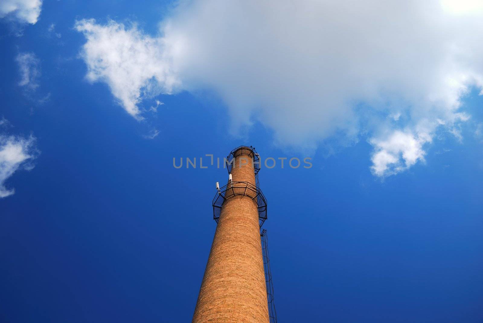 urban chimney-stalk on a background cloudy sky