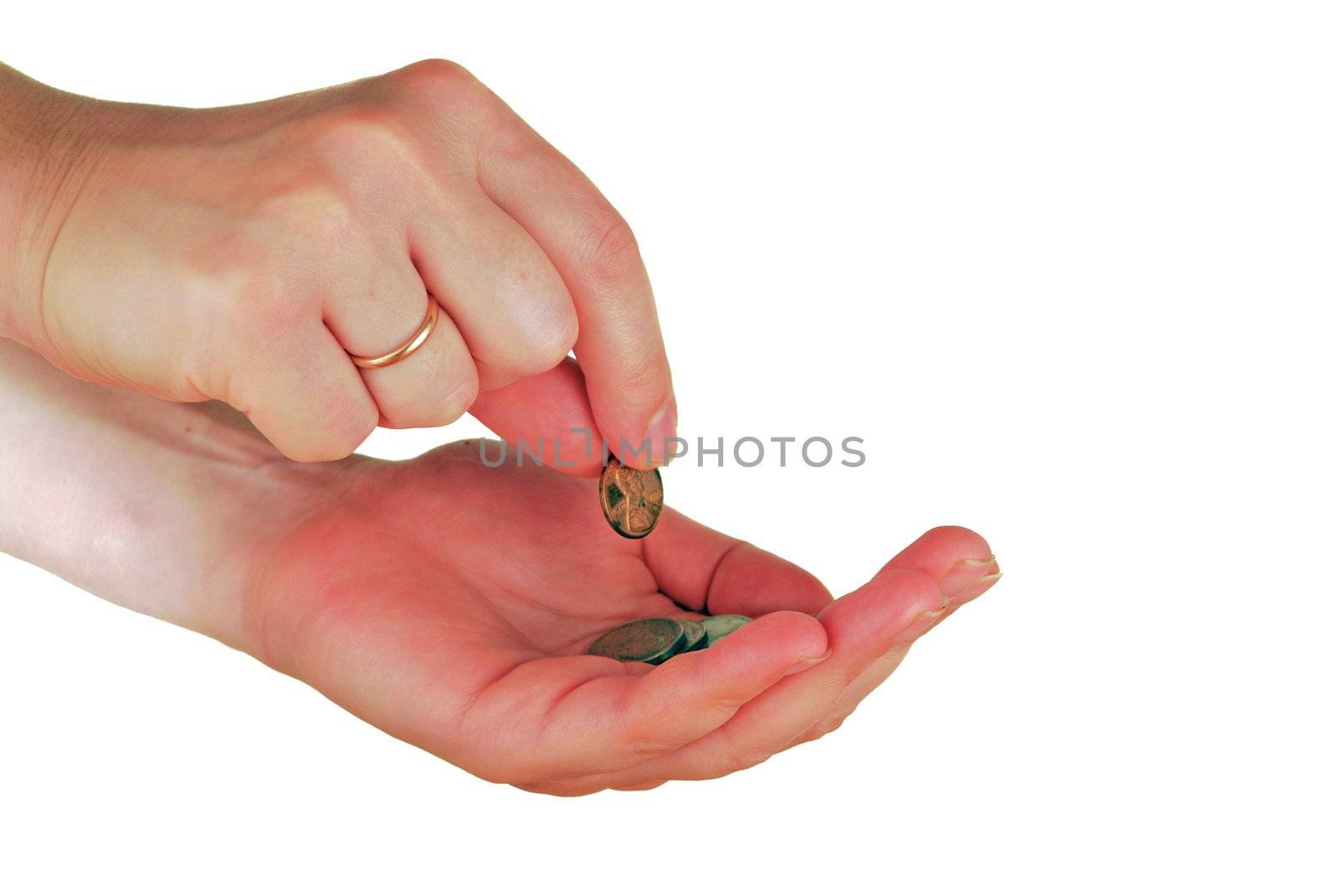 a womanish hand holds a coins on a palm