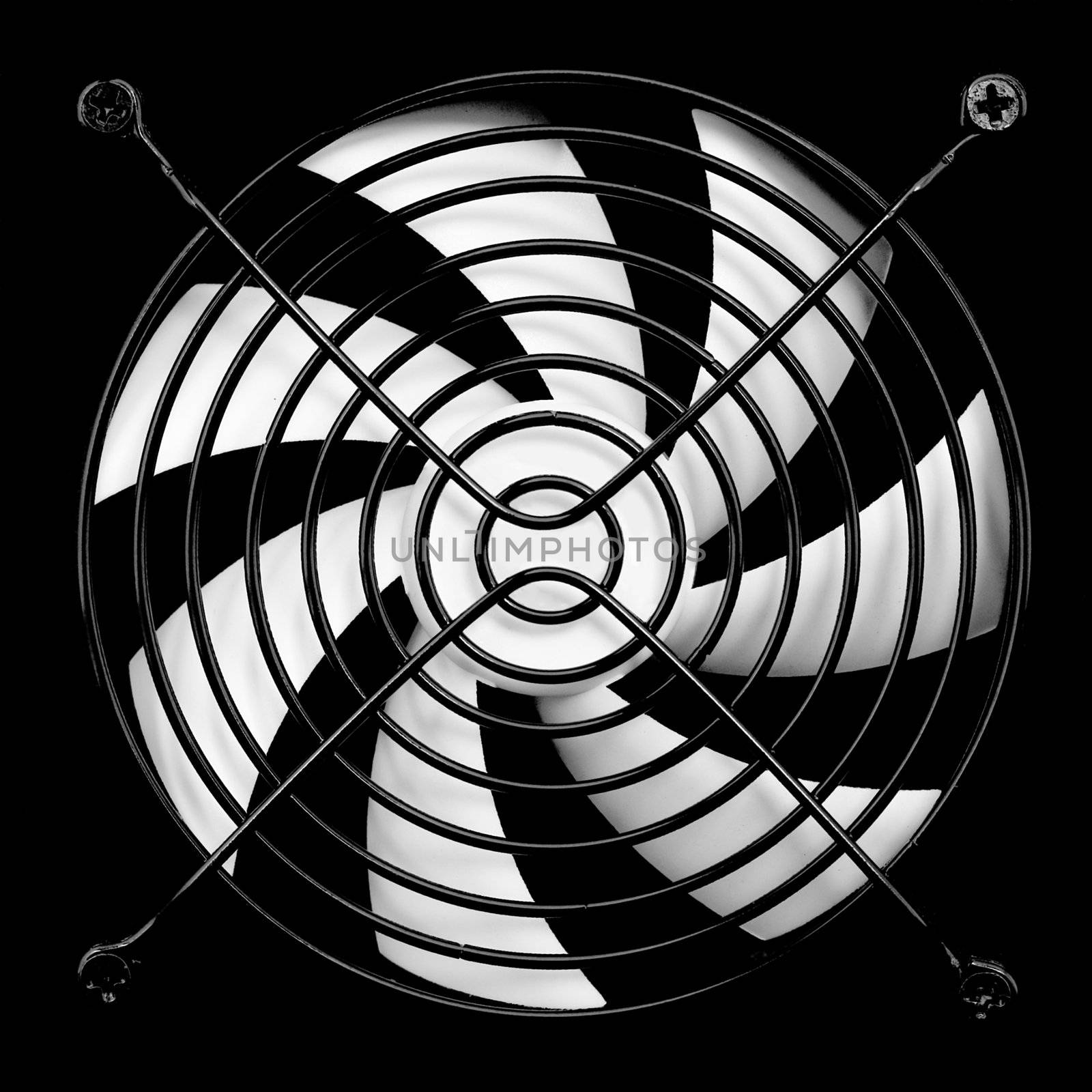 The computer fan of white colour on a black background