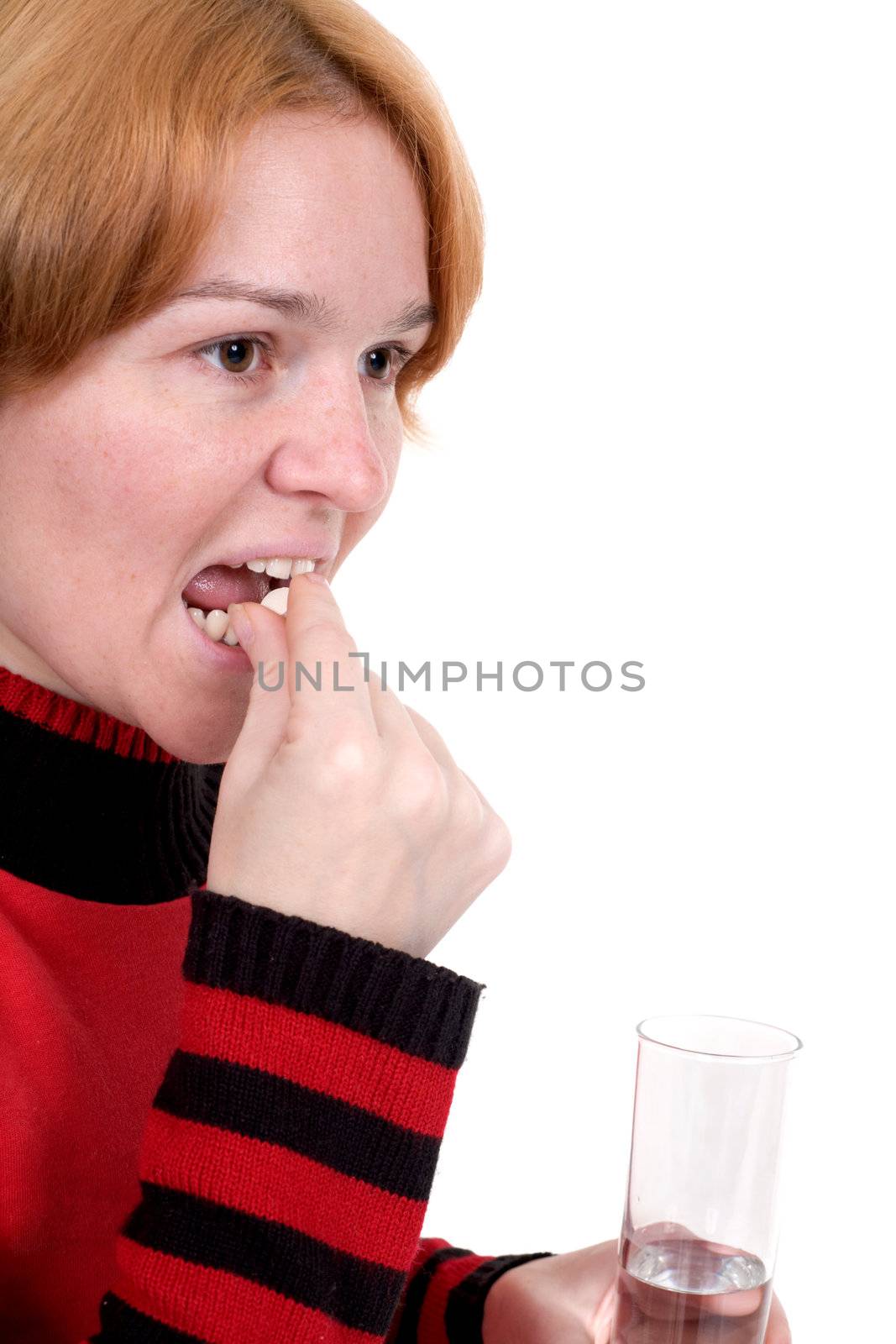 The girl with tablets and a glass