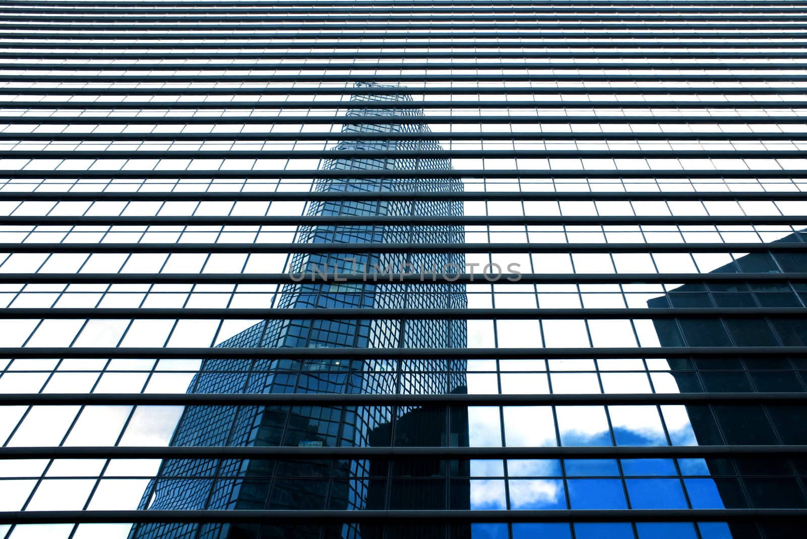 Business buildings reflection with blue sky
