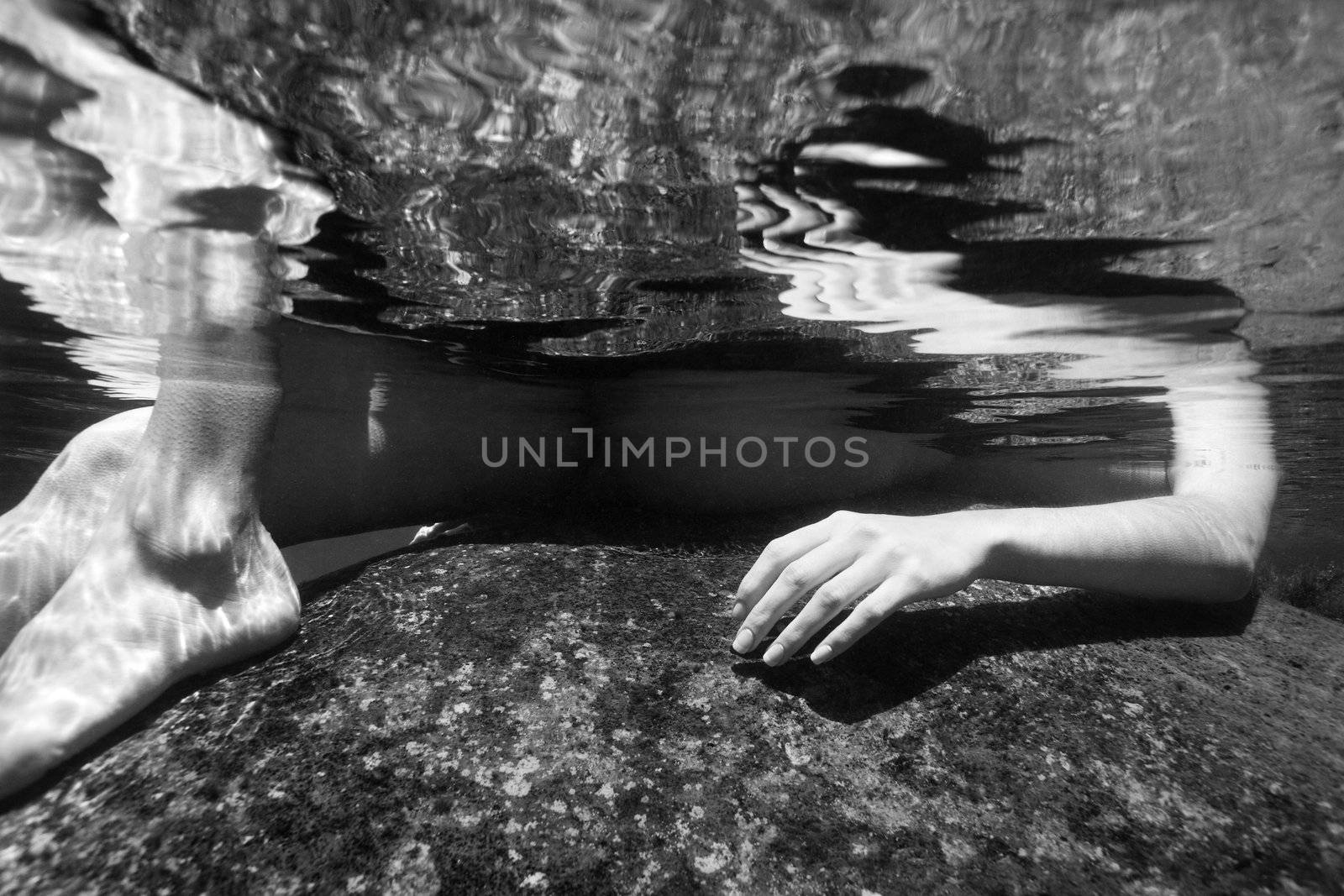 Nude woman underwater. by iofoto