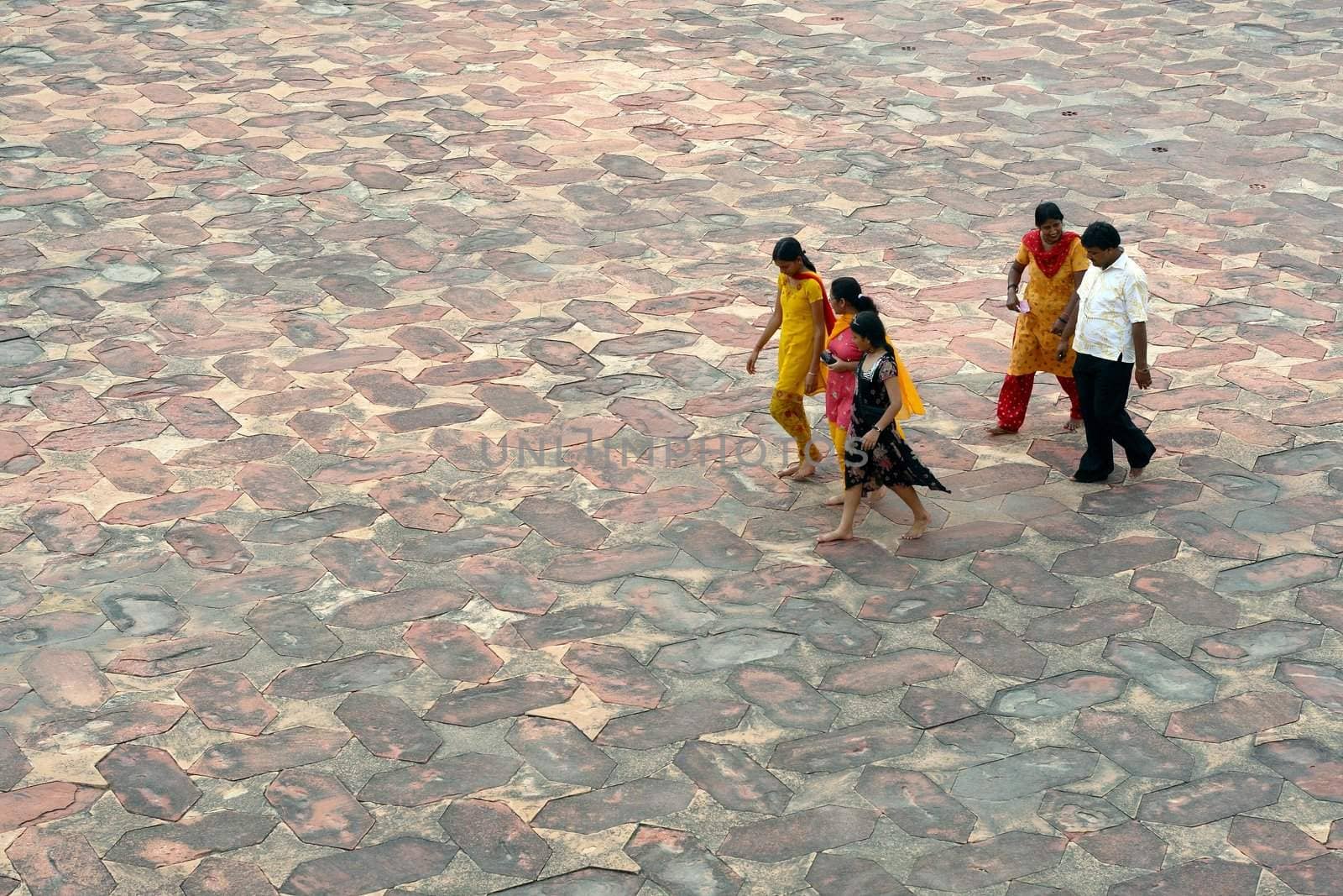 Asian family walk on stony street