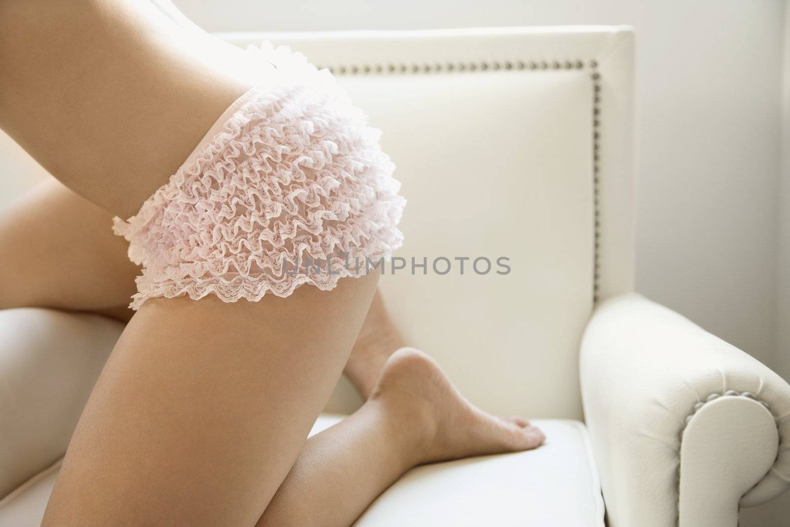 Woman in pink underwear. by iofoto