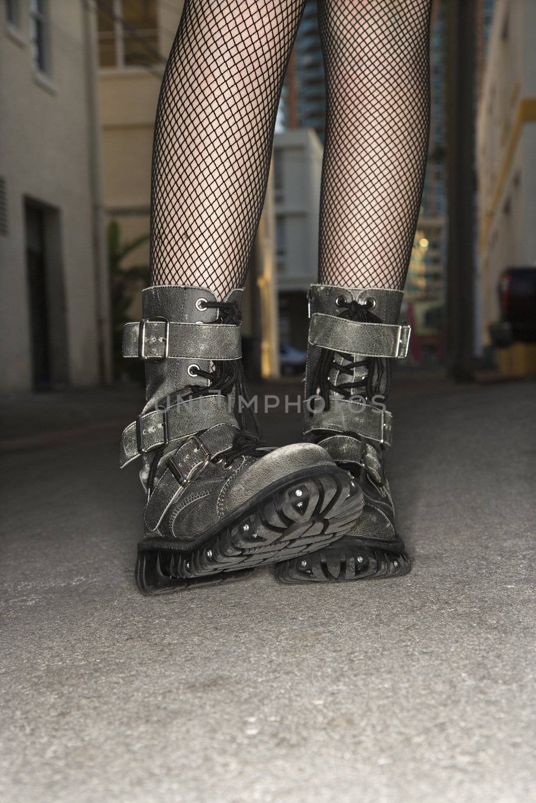 Woman wearing boots. by iofoto