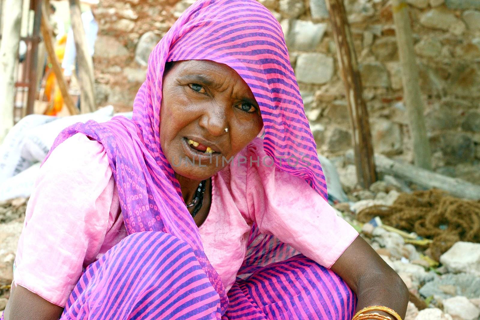 Old woman wearing pink sari