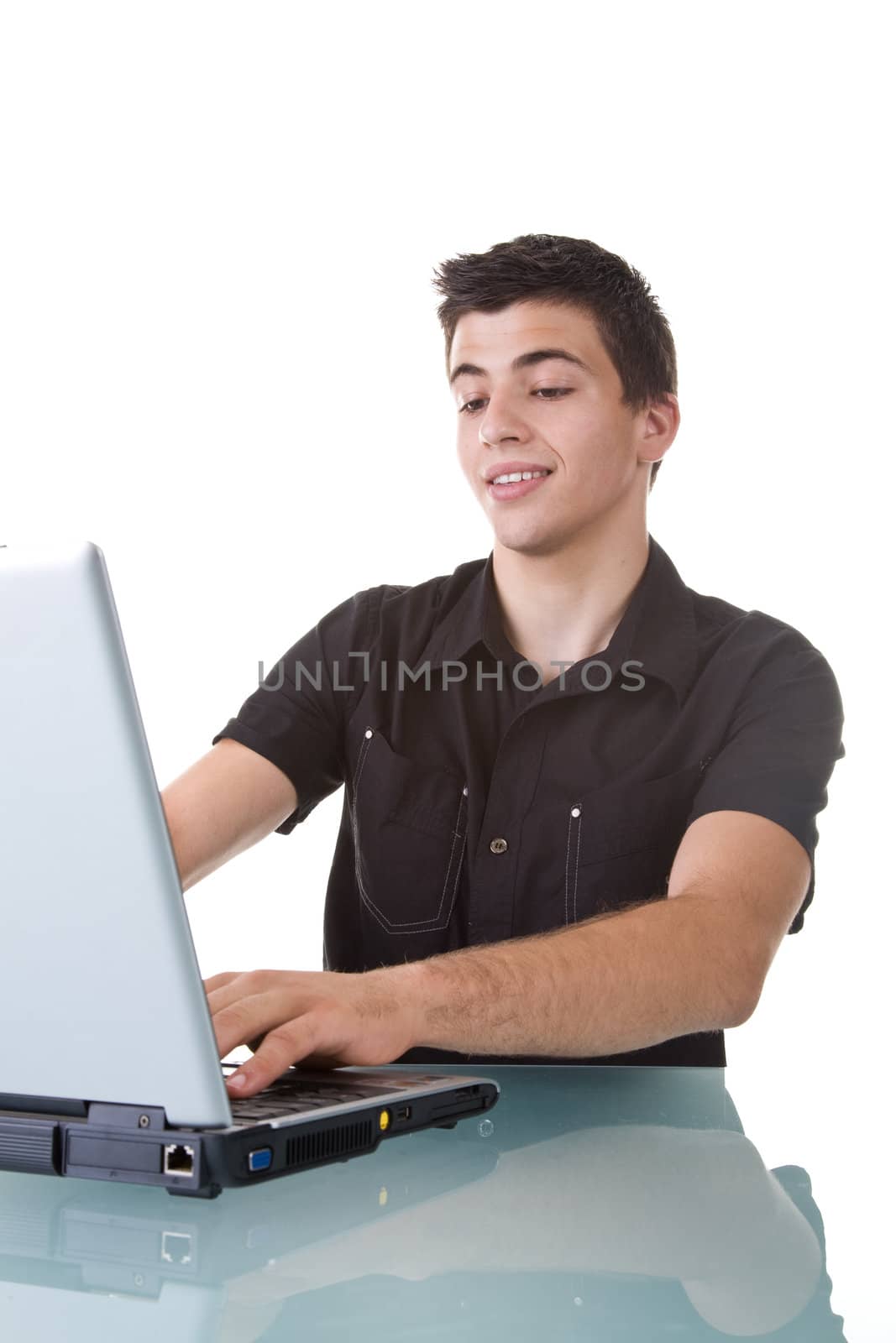 Young man using a laptop. Isolated on white background.