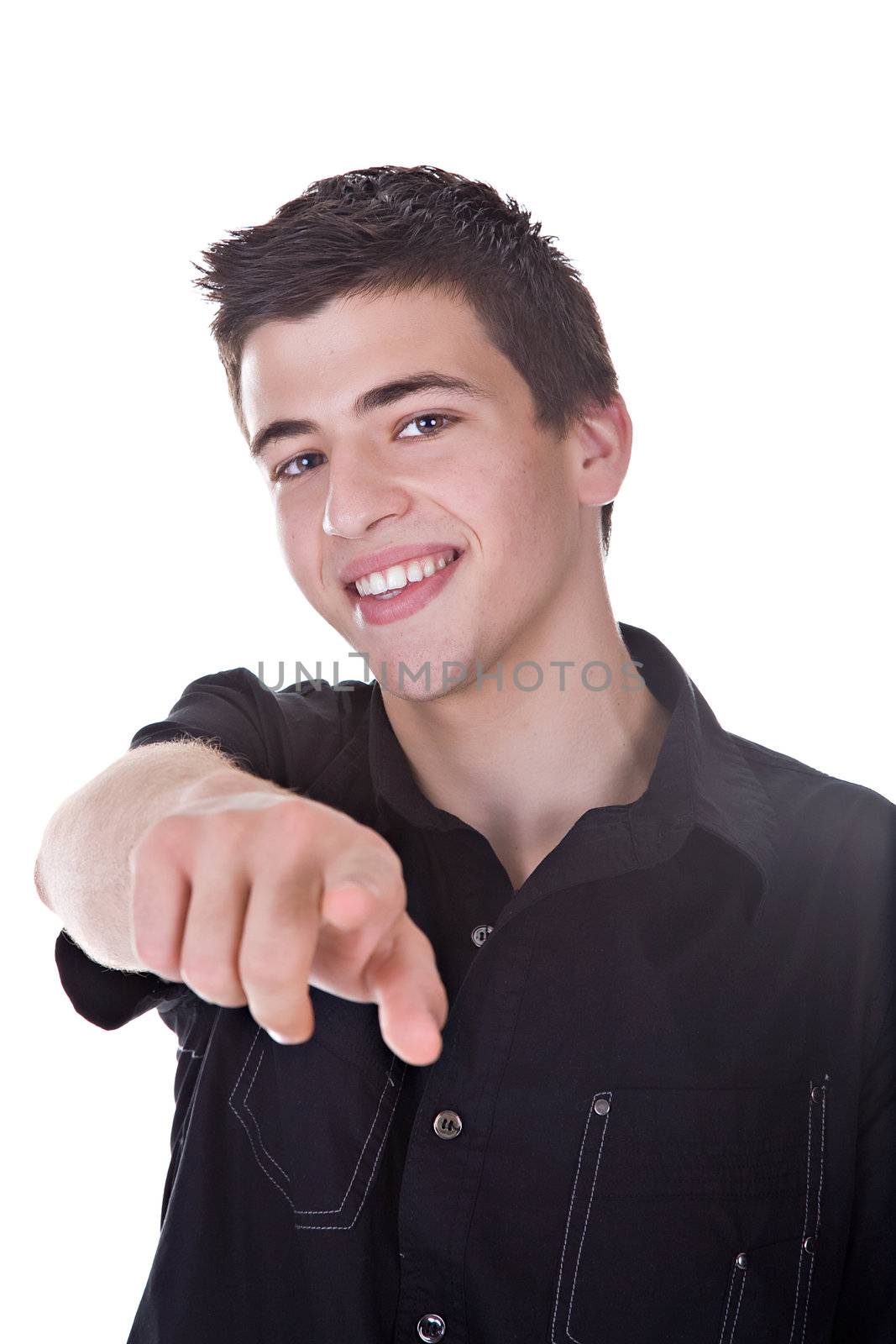 Portrait of a young man smiling, point at you. Studio shot. Isolated on white.