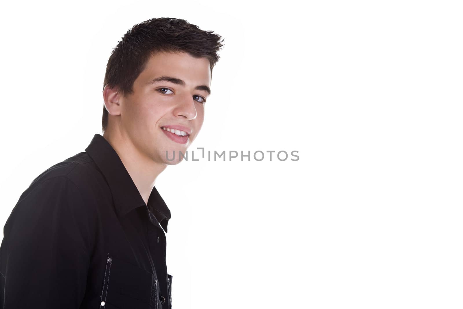 Portrait of a handsome young man, wearing a black shirt, smiling. Isolated on white background.