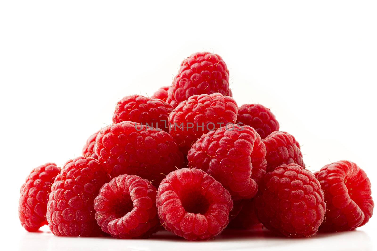 some red raspberries isolated on white background