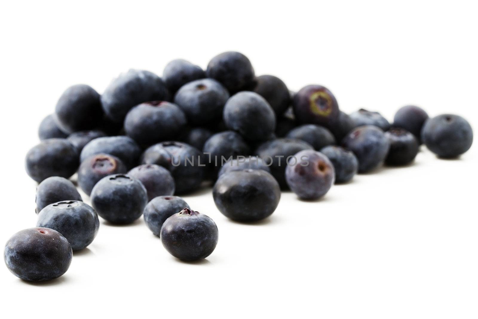 some tasty blueberries isolated on white background