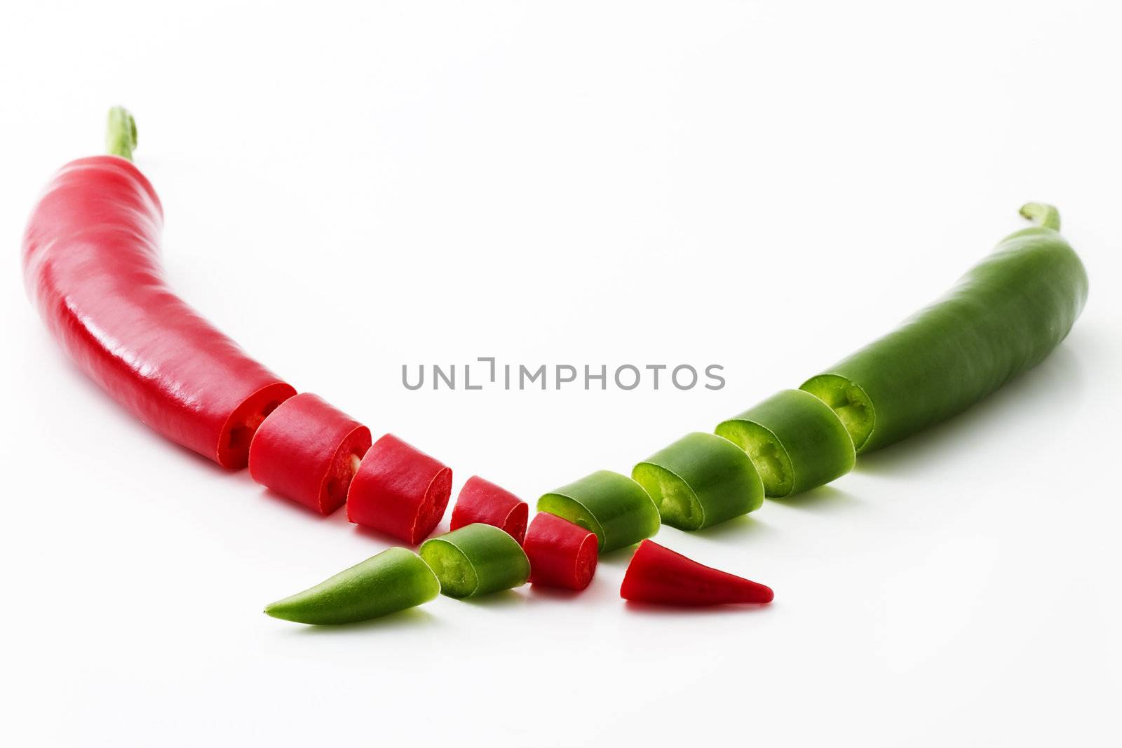 cutted red and green chili isolated on white background