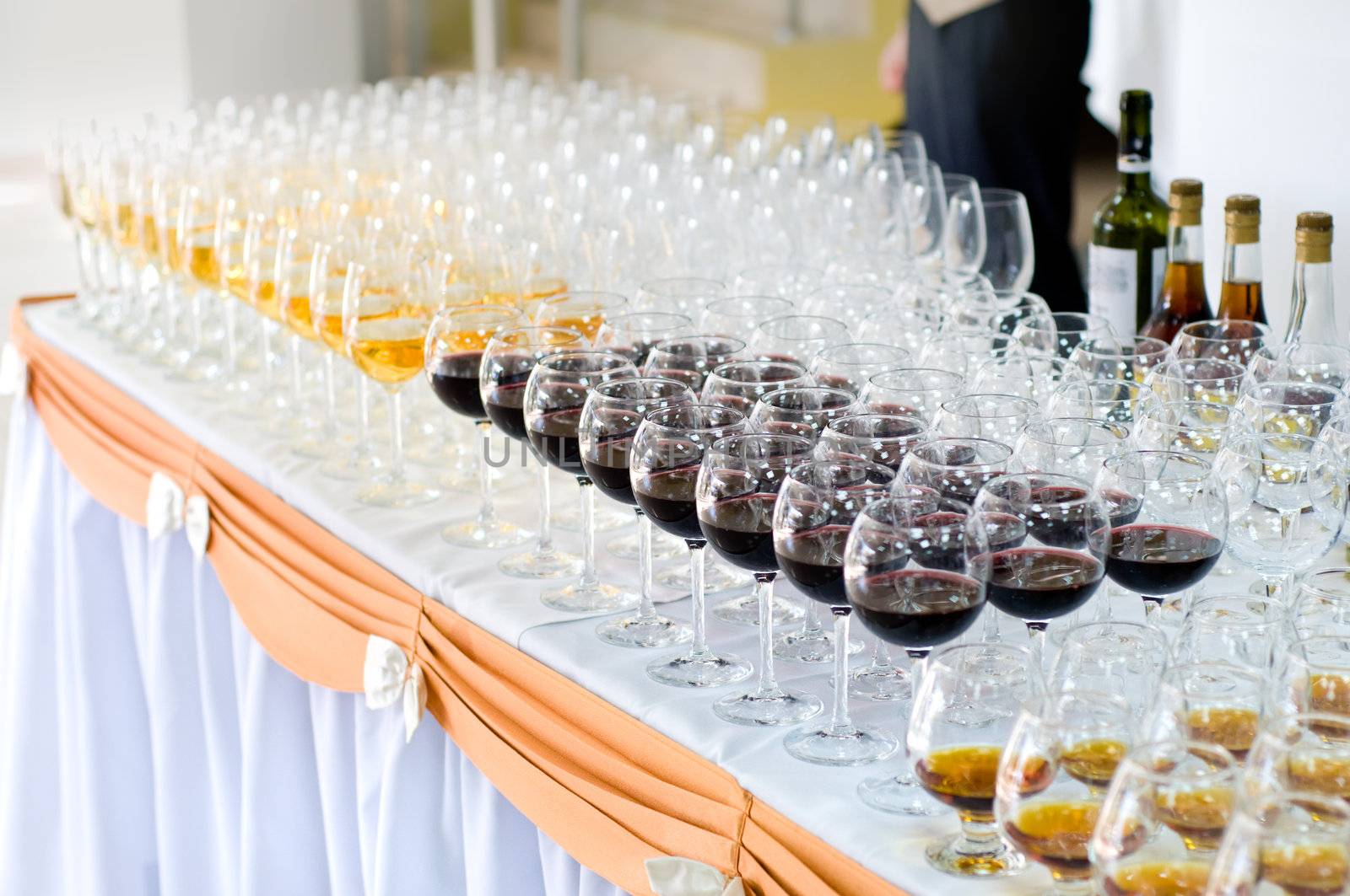 array of wineglasses, selective focus by starush