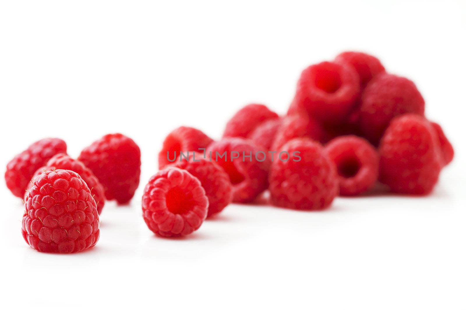 some red raspberries isolated on white background