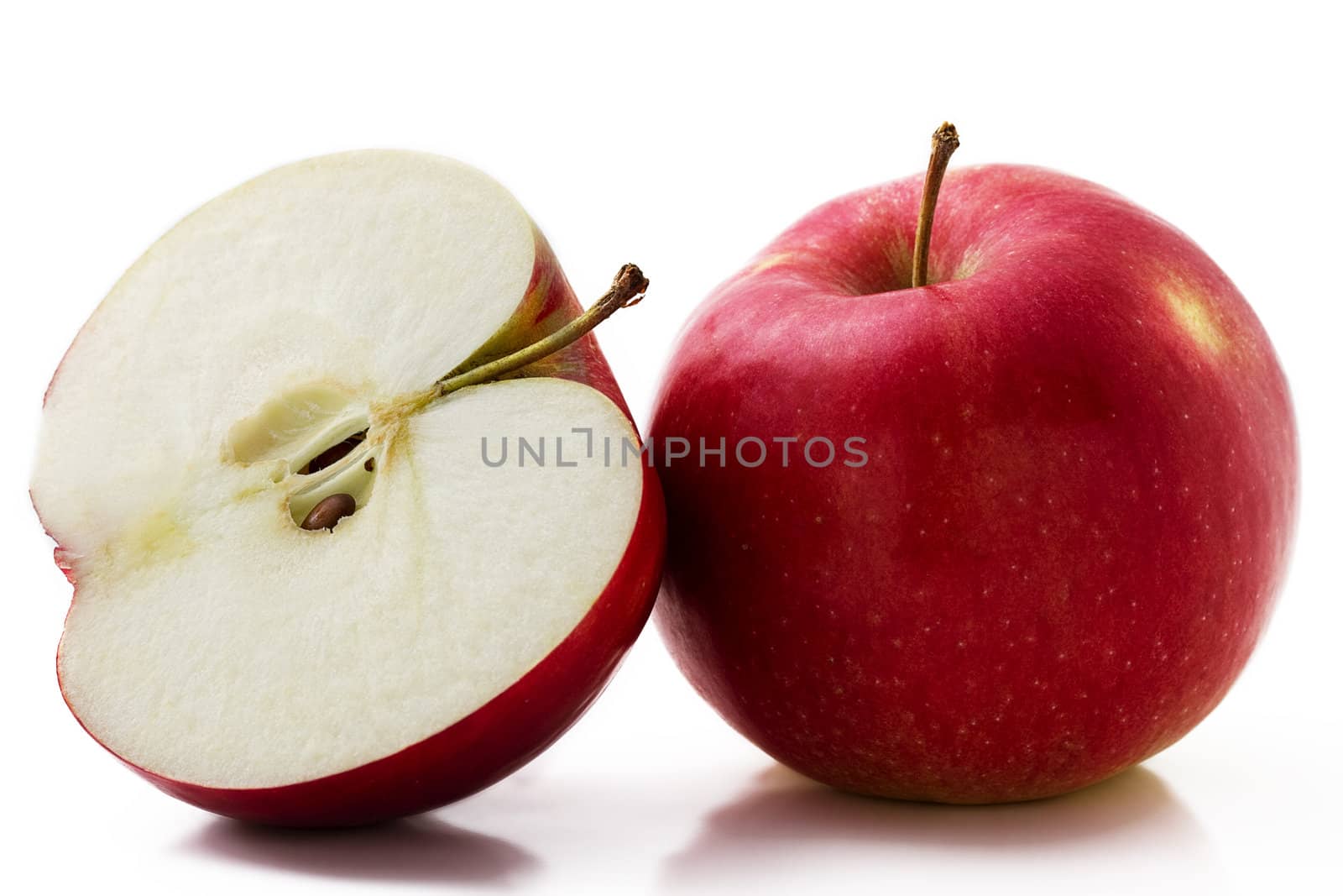 one red apple and a half isolated on white background