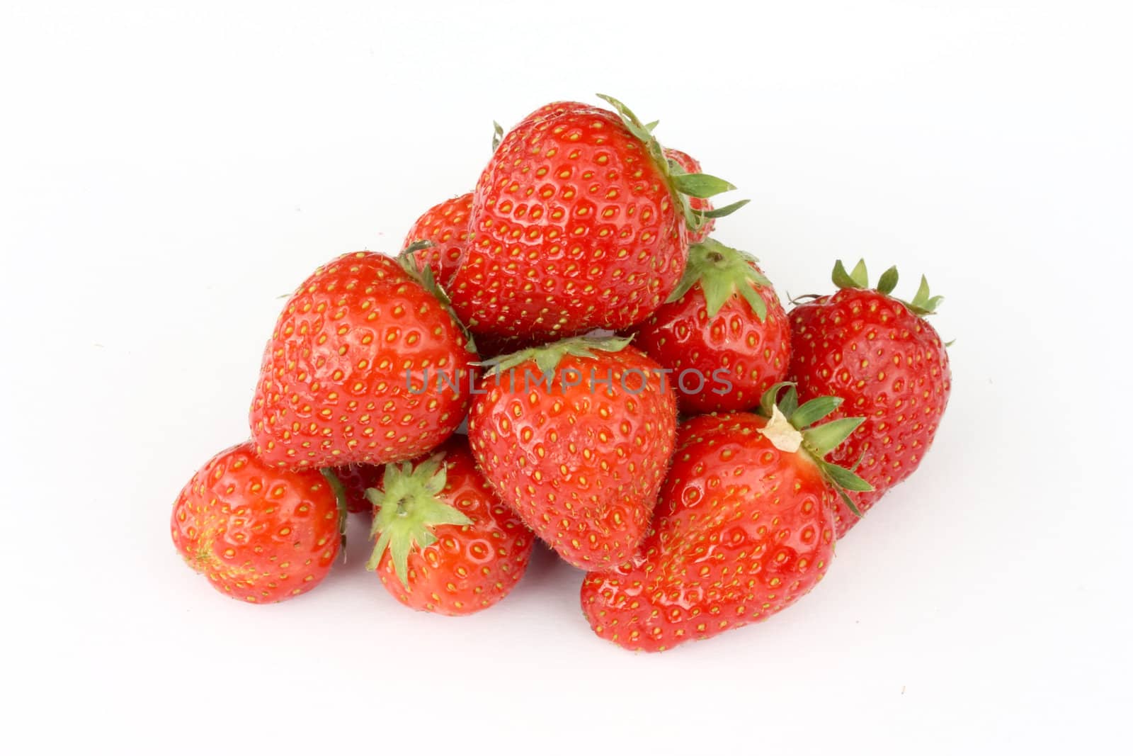 Heap of strawberries isolated on white background