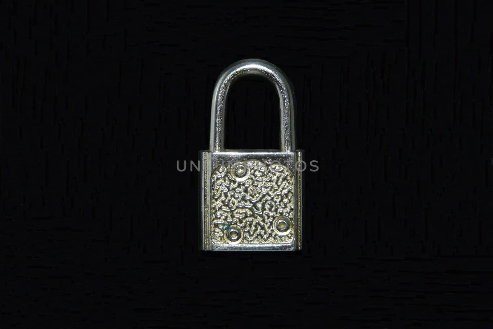 Locked padlock on black background