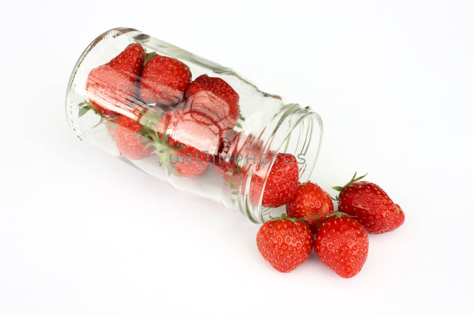 Strawberries in jar isolated on white background