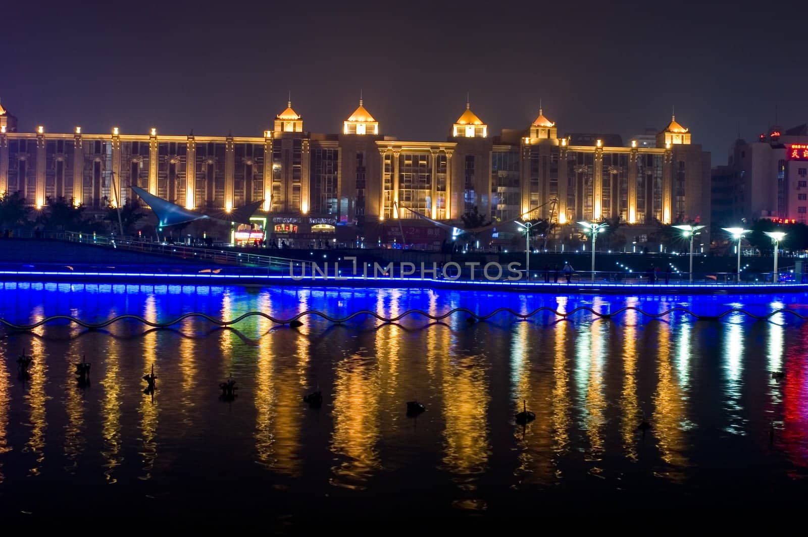 Nightscape of Nantong city, Jiangsu province, China. Wonderful cityscape with famous Haohe river. 