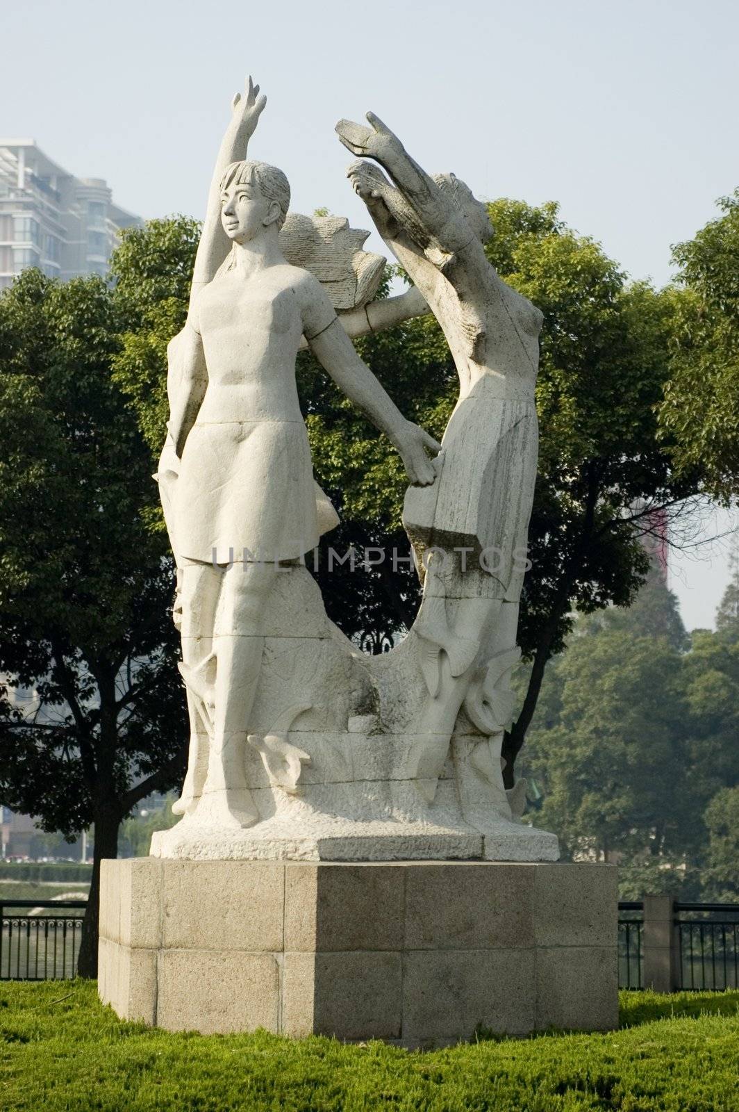 China, Jiangsu province, Nantong city center. Sculpture showing young Chinese females excersising.