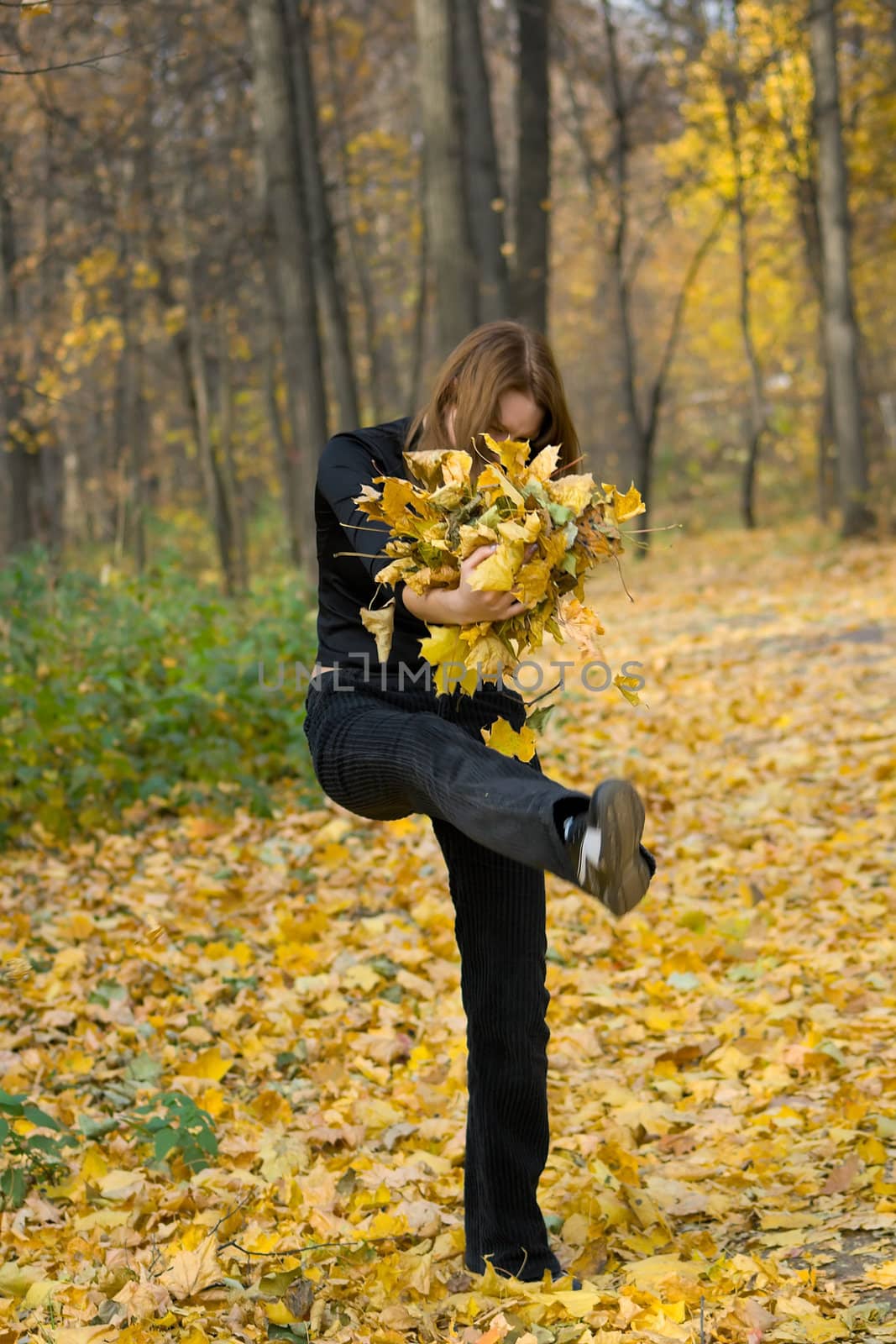 The young girl against autumn nature