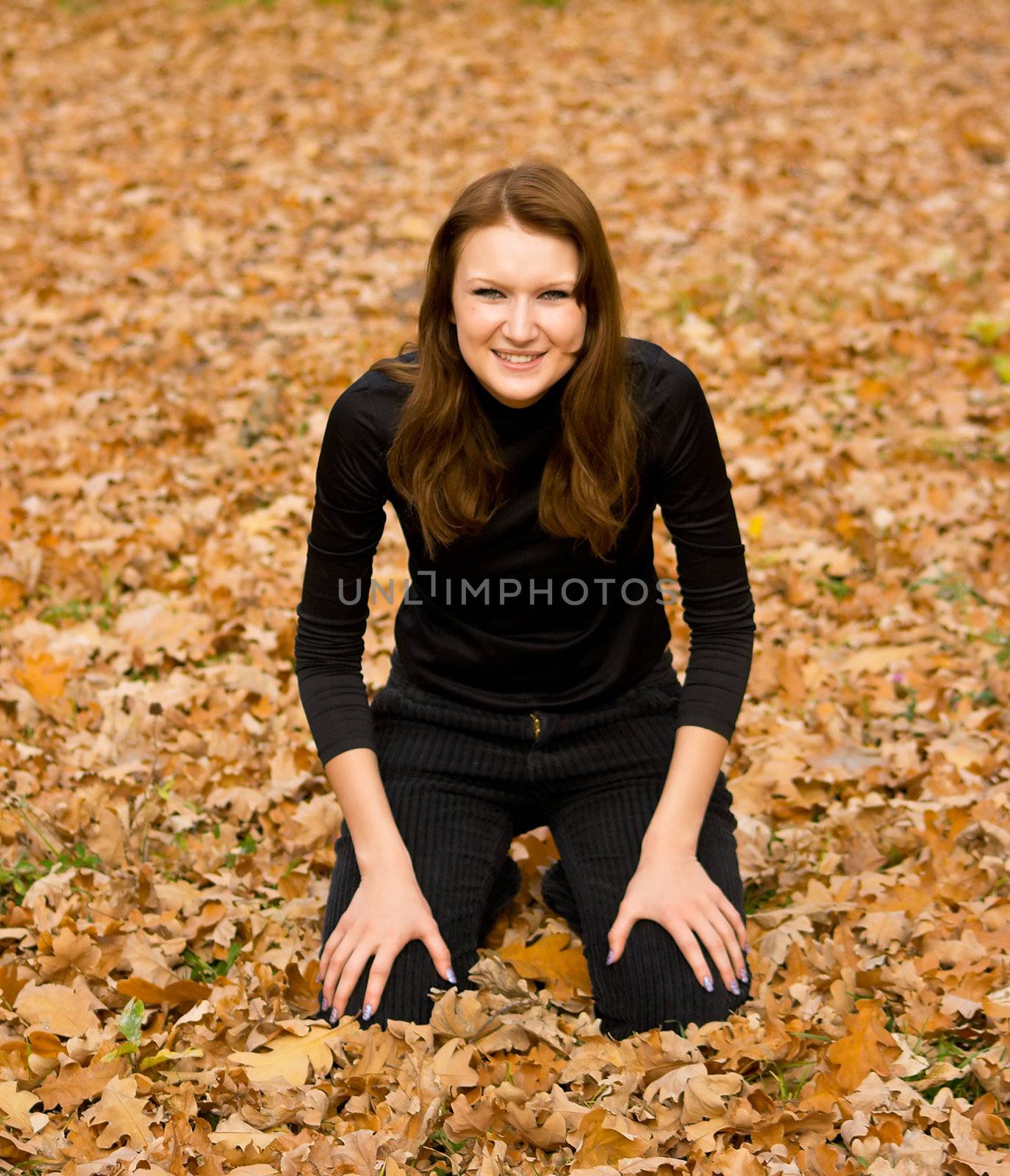 The young girl against autumn nature