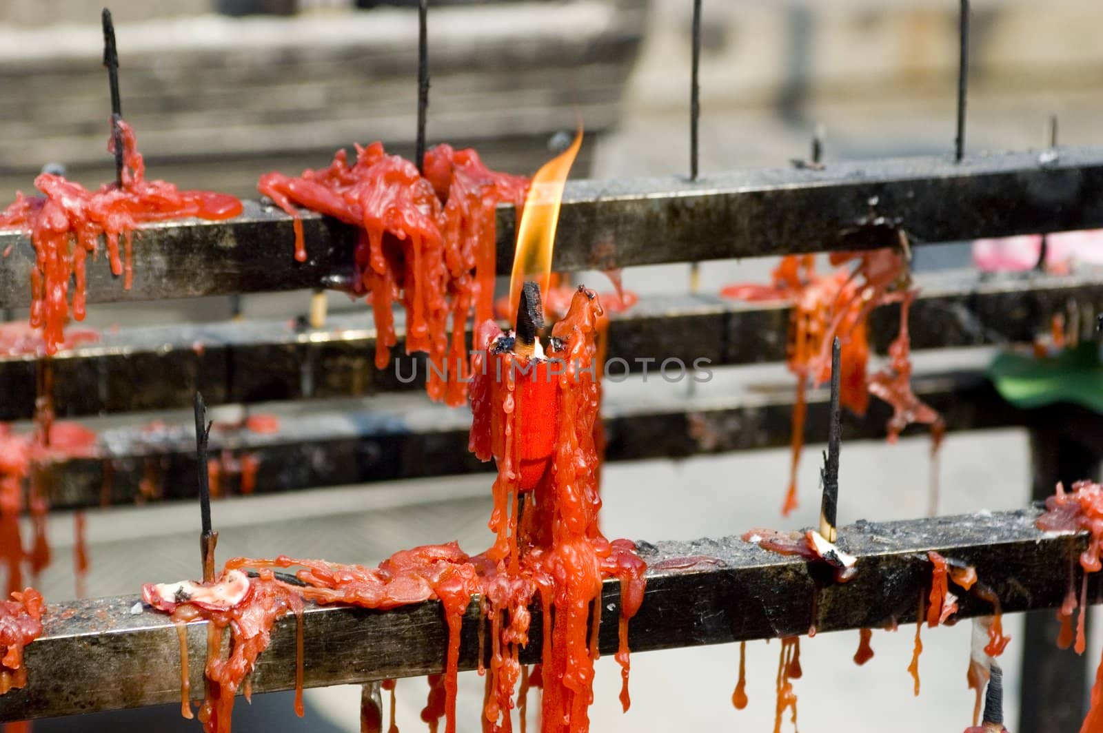 Burned candles outside of traditional, Chinese temple in Nantong city, Jiangsu province.