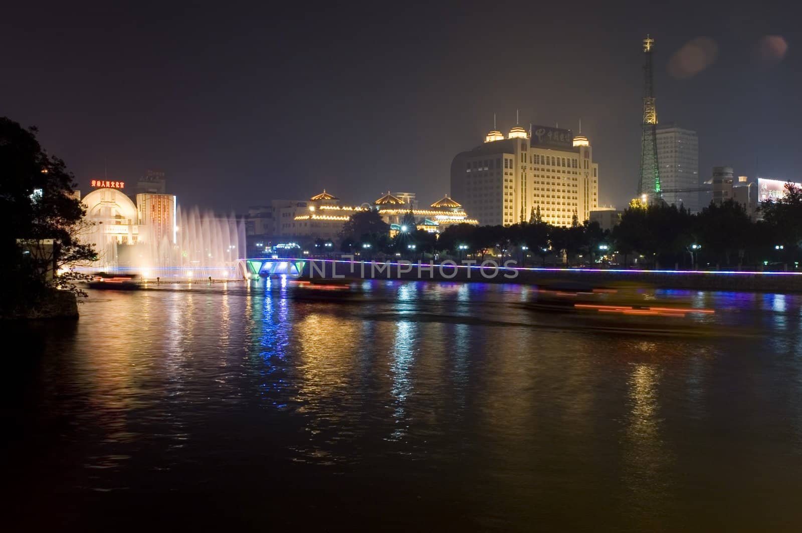 Nightscape of Nantong city, Jiangsu province, China. Wonderful cityscape with famous Haohe river. 