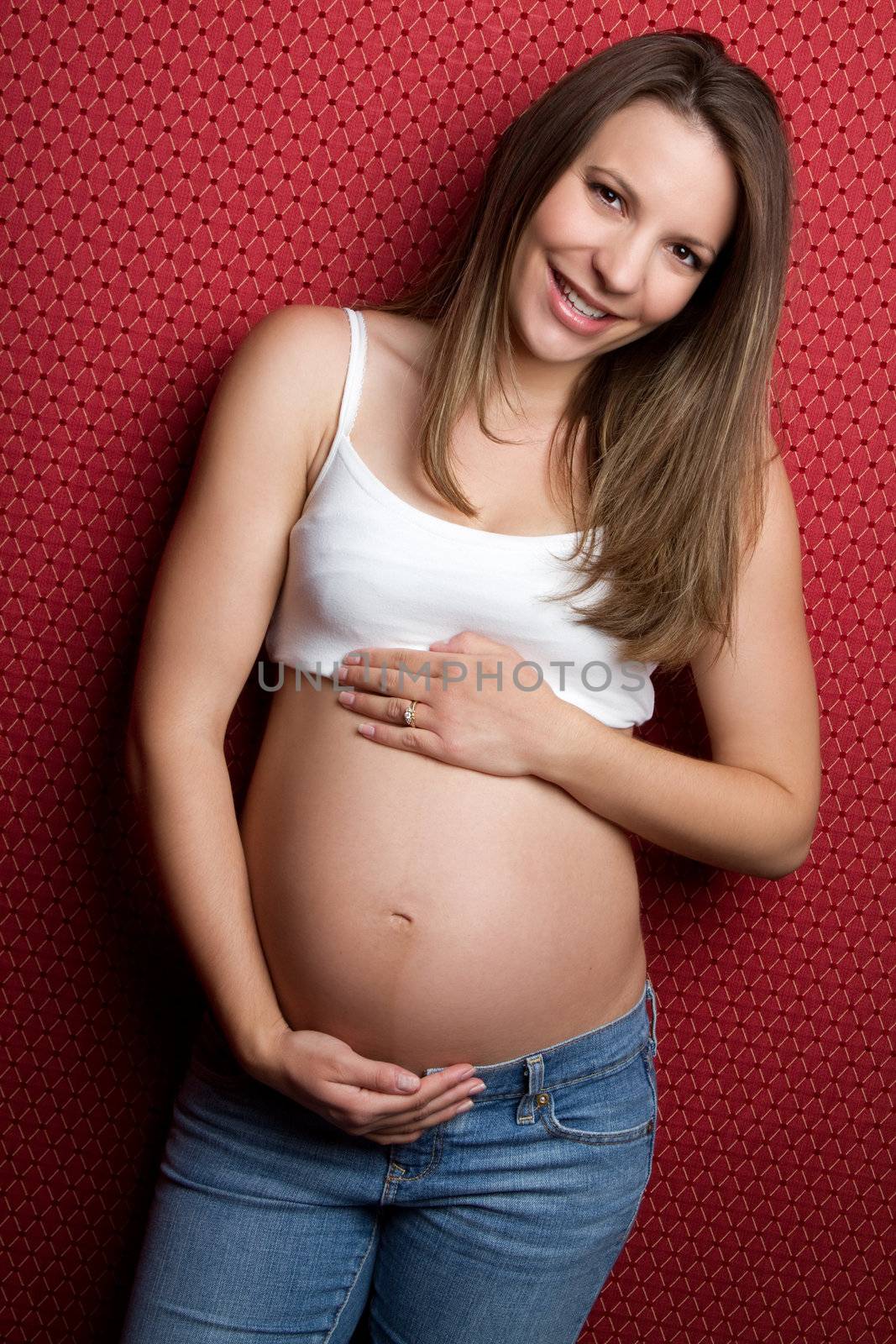 Beautiful happy young pregnant girl