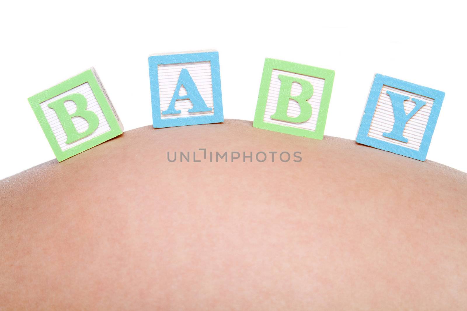 Baby blocks on pregnant belly